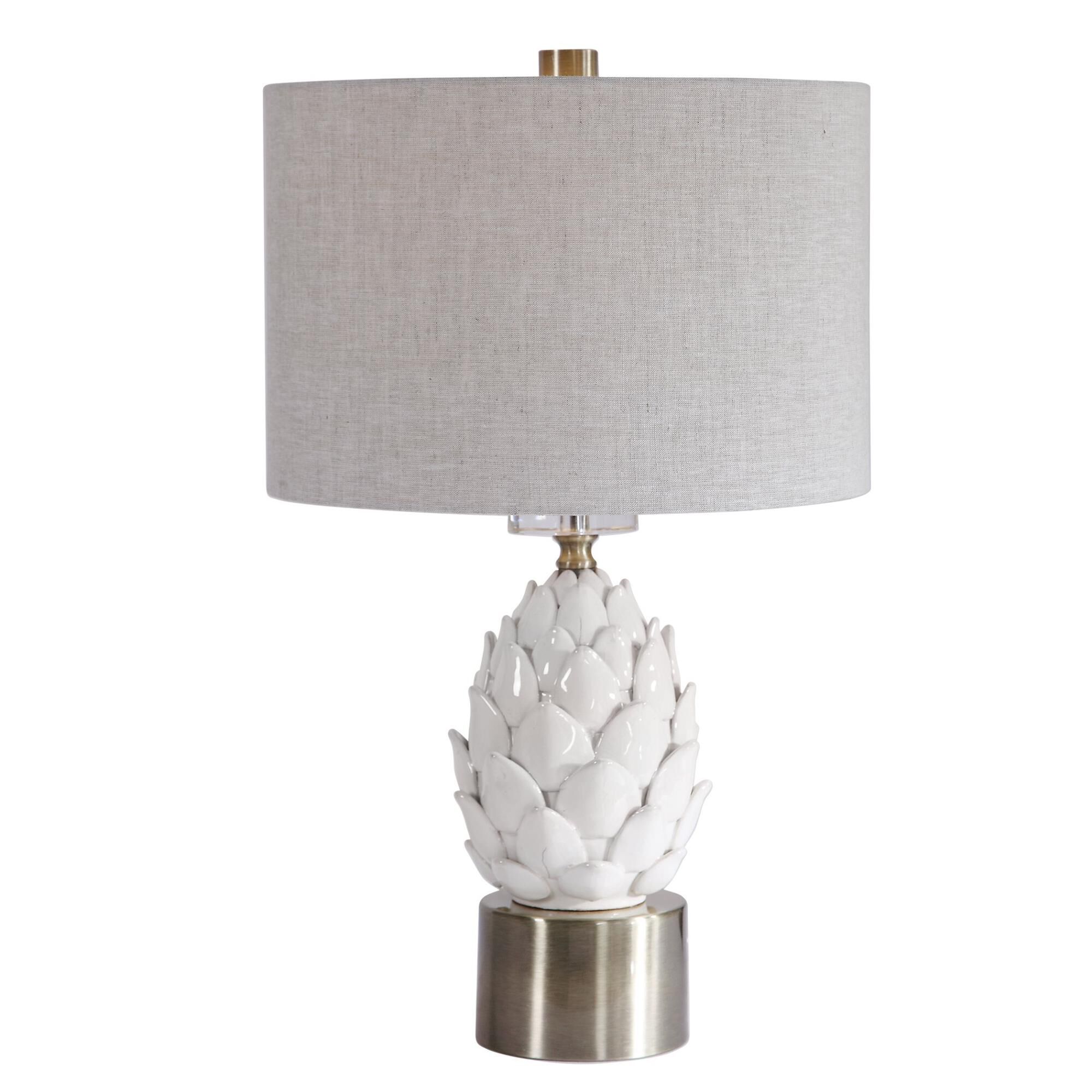 Shown in A White Ceramic Artichoke In A White Crackled Glaze With Aged Brown Tips Accents This Table Lamp. Br finish and Round Drum Hardback shade