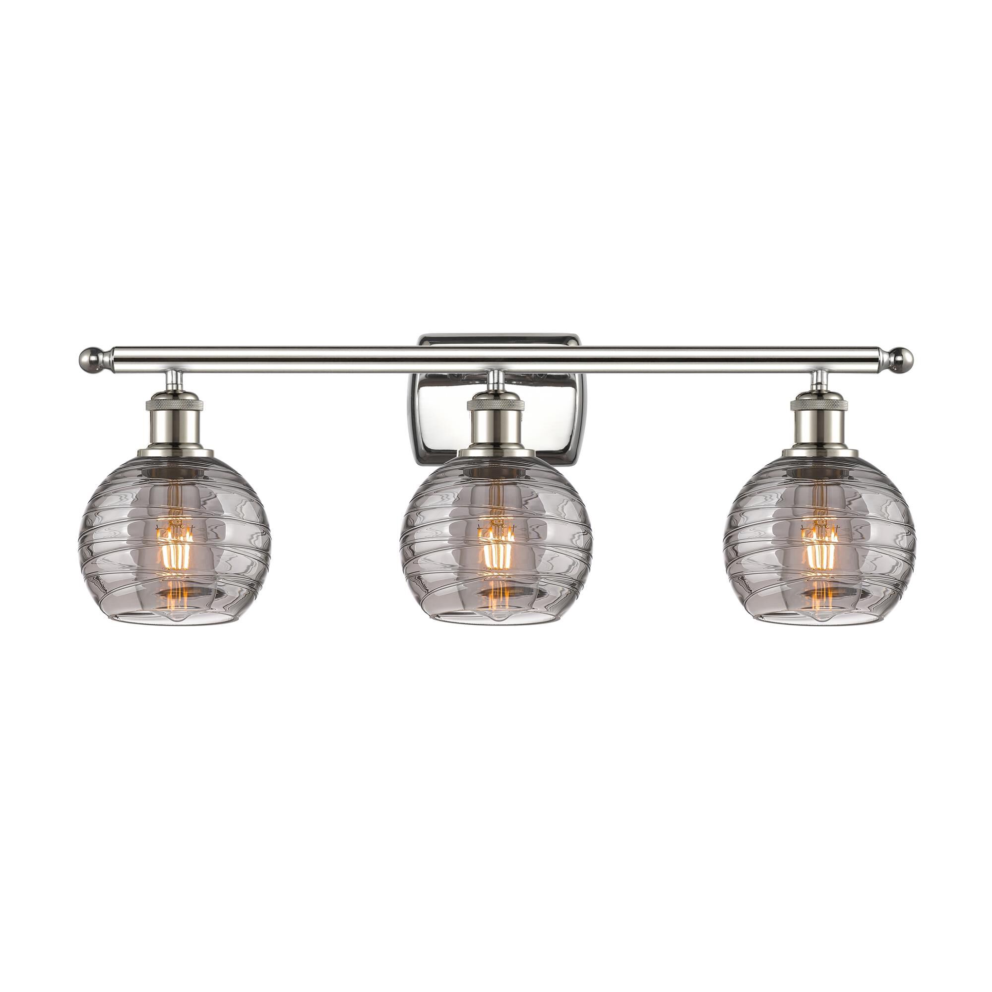 Shown in Polished Nickel finish and Light Smoke Deco Swirl glass