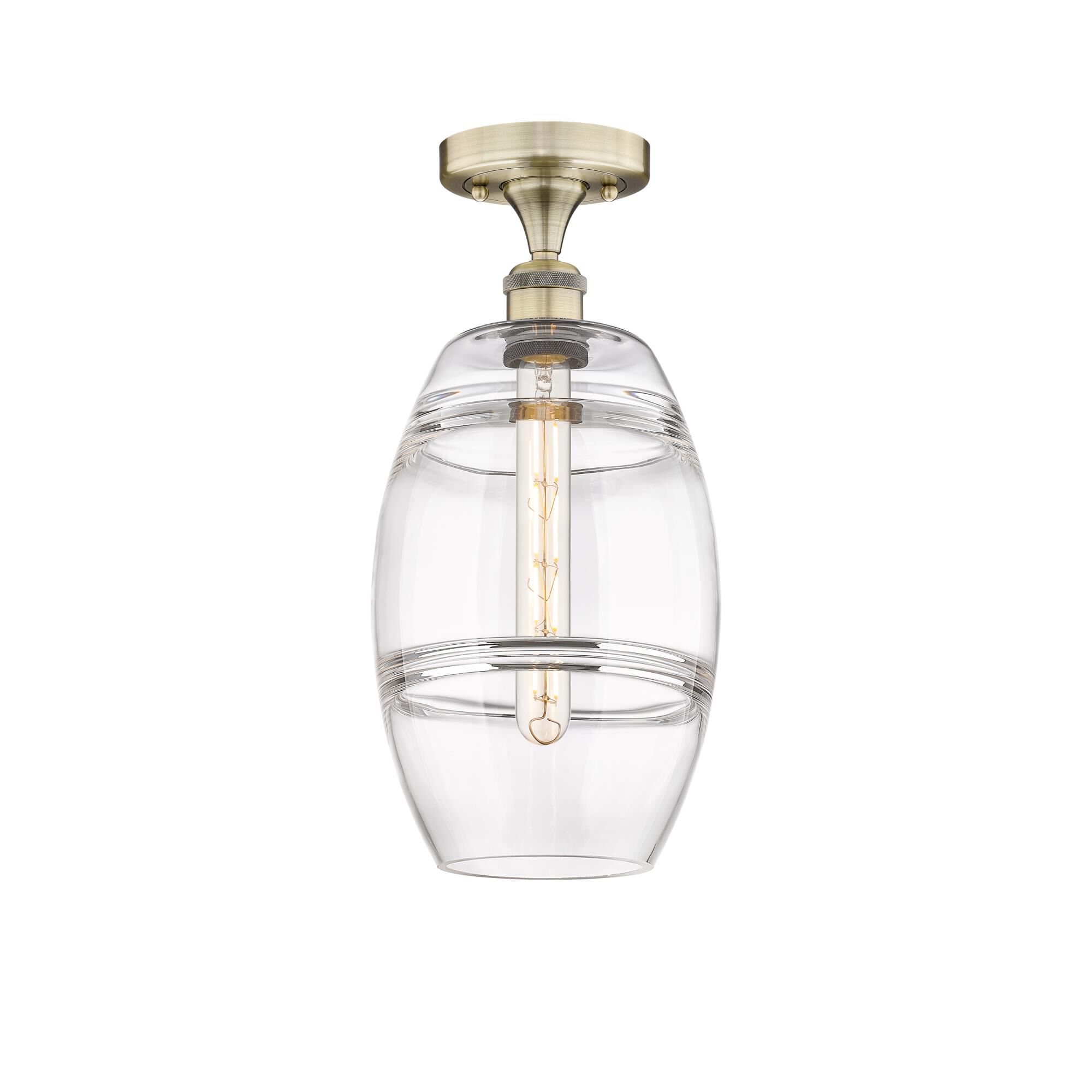 Shown in Antique Brass finish and Clear glass