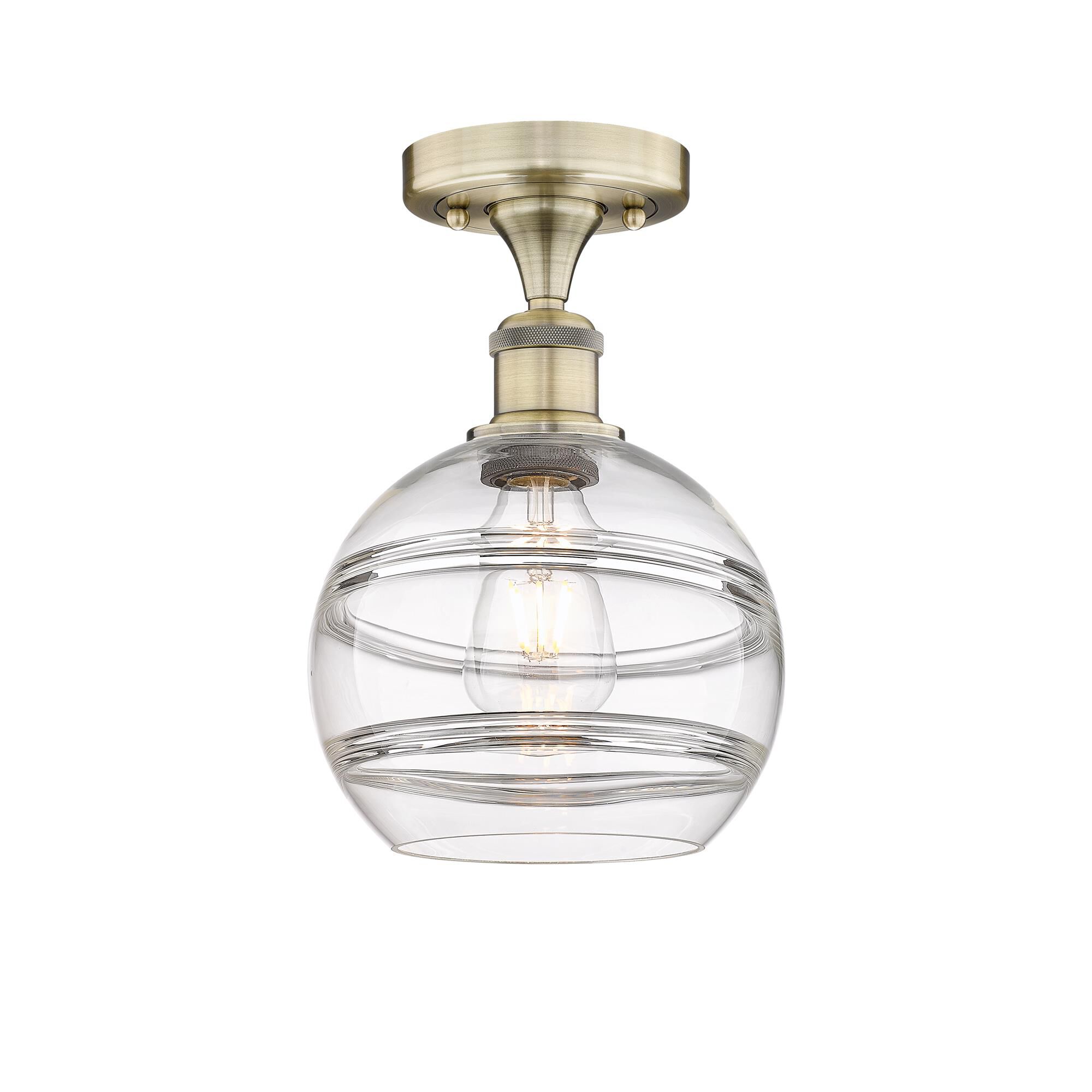 Shown in Antique Brass finish and Clear glass