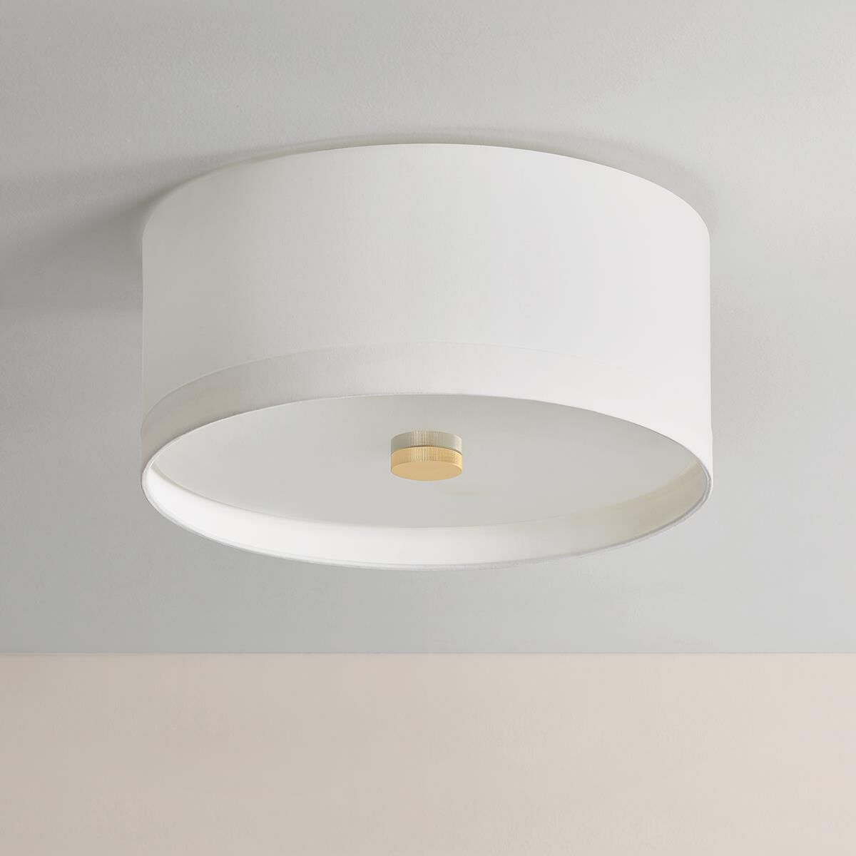 Shown in Aged Brass finish and White Linen shade