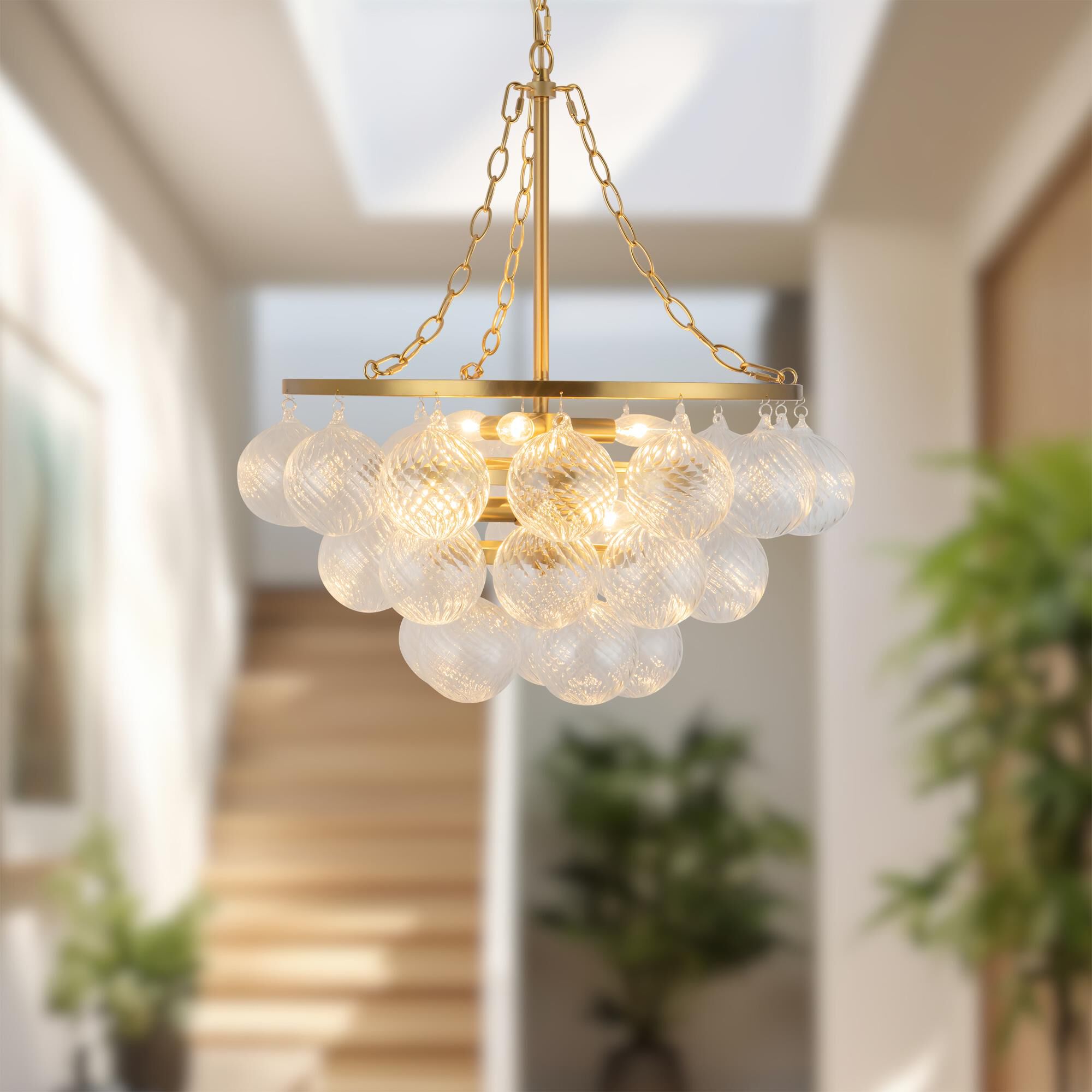 Shown in Brushed Gold finish and Clear Ribbed glass