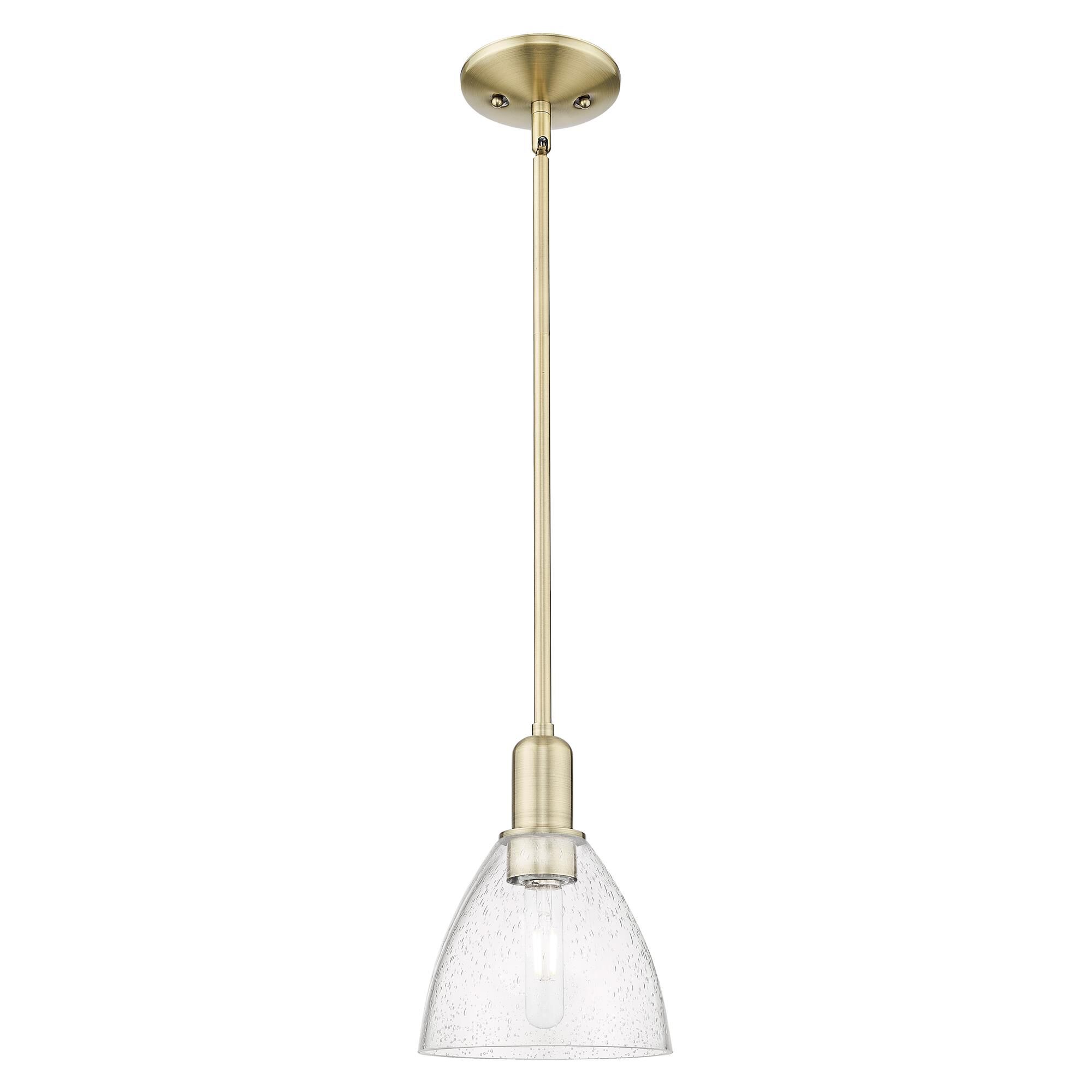 Shown in Antique Brass finish and Seedy glass