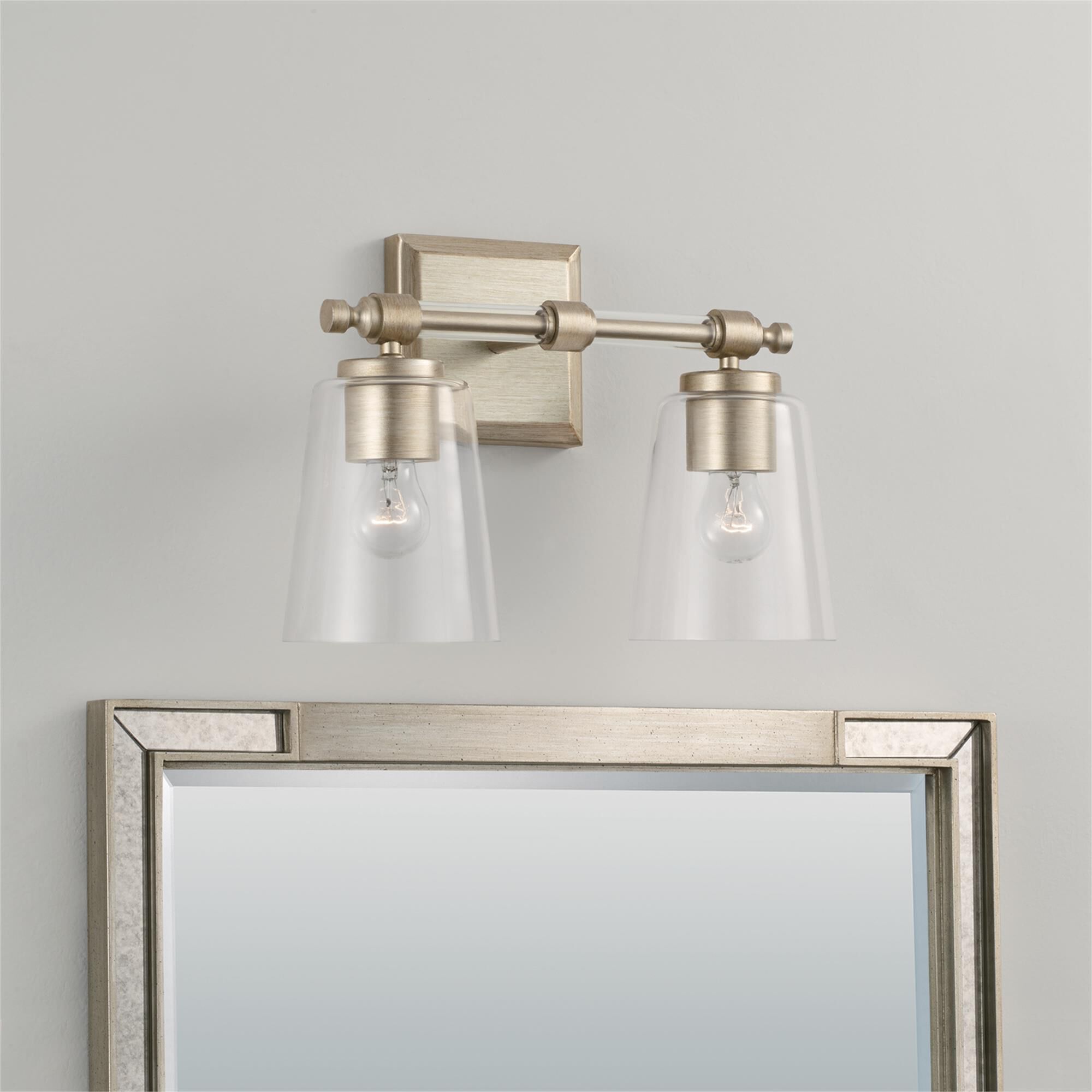 Shown in Brushed Champagne finish and Clear glass