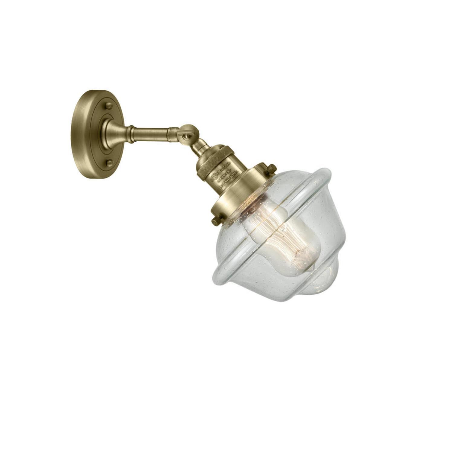 Shown in Antique Brass finish and Seedy glass