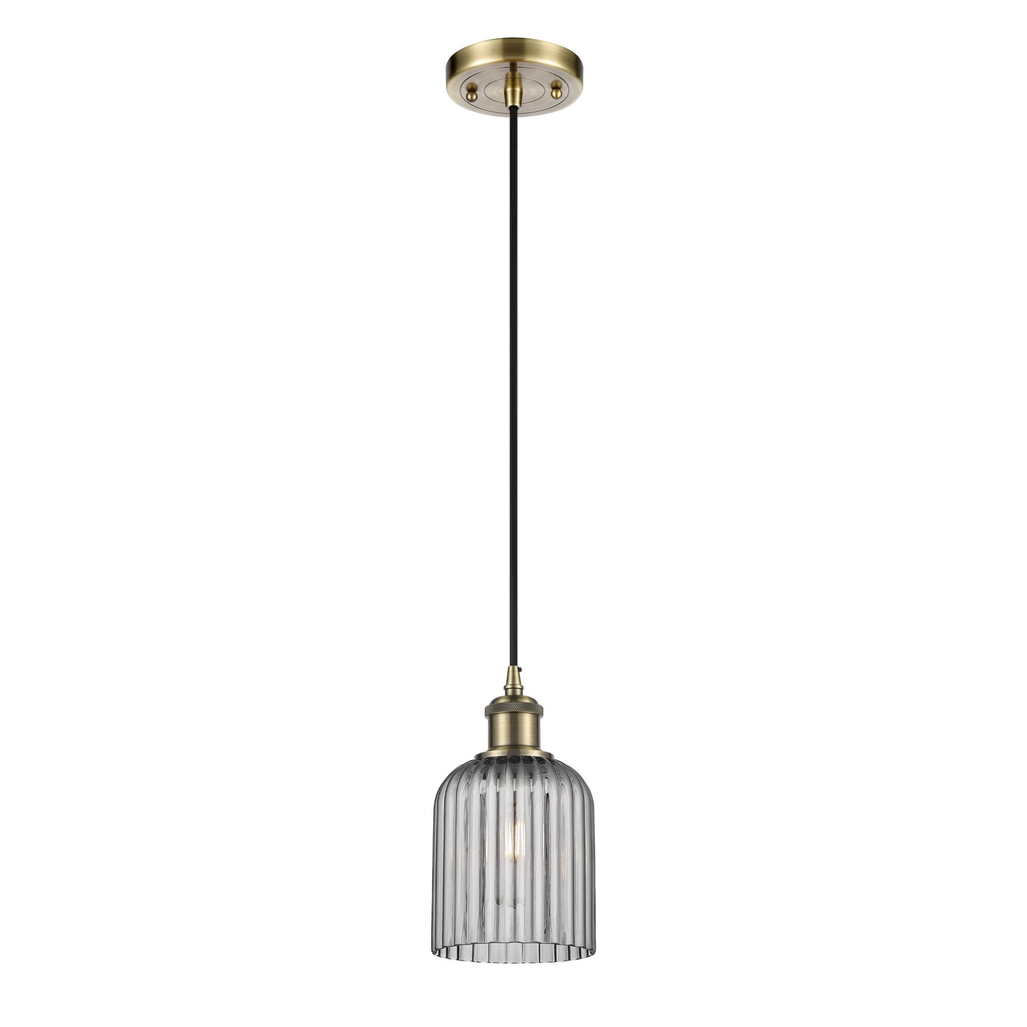 Shown in Antique Brass finish and Light Smoke shade