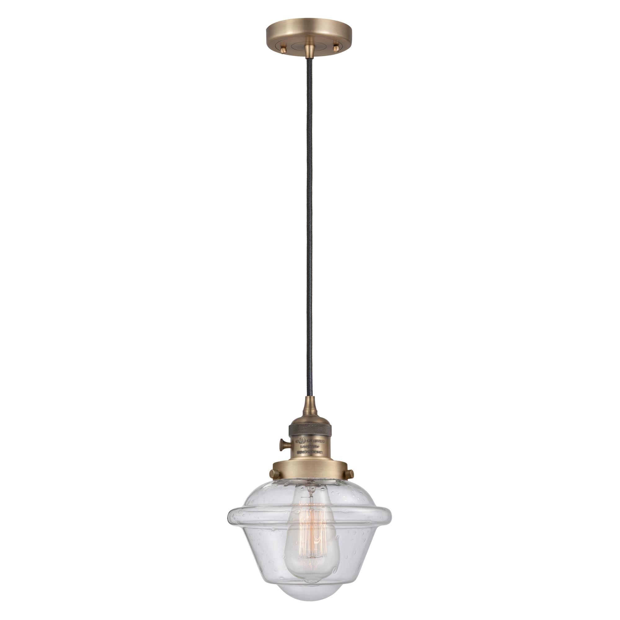 Shown in Brushed Brass finish and Seedy glass