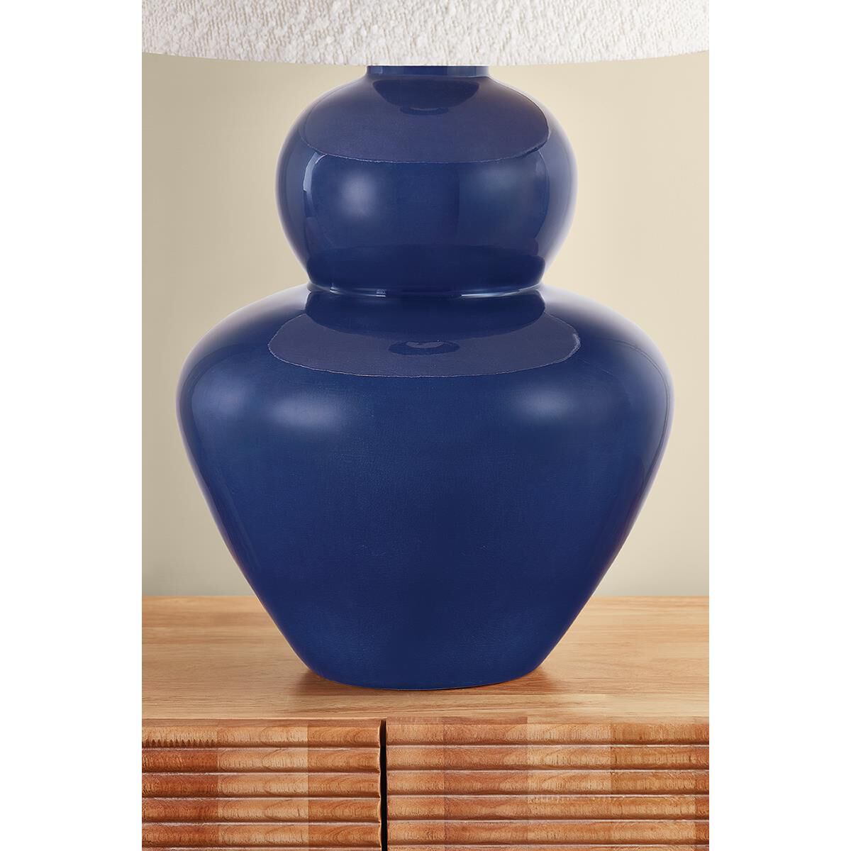 Shown in Aged Brass and Ceramic Egyptian Blue finish and Boucle shade