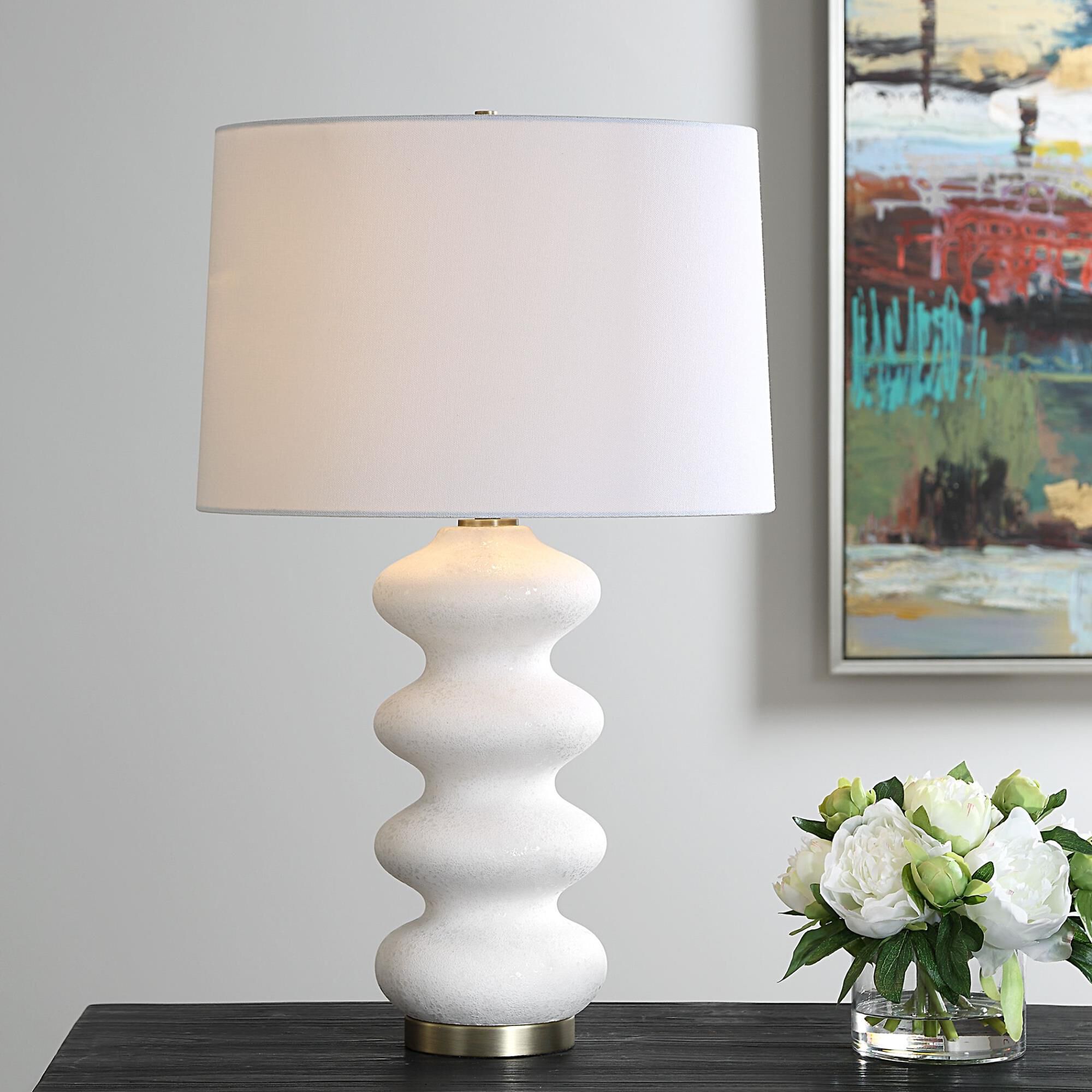 Shown in This Porcelain Lamp Exudes An Elegant Quality With Its Graceful Flowing Design And White Tone-On-Ton finish and Round Hardback shade