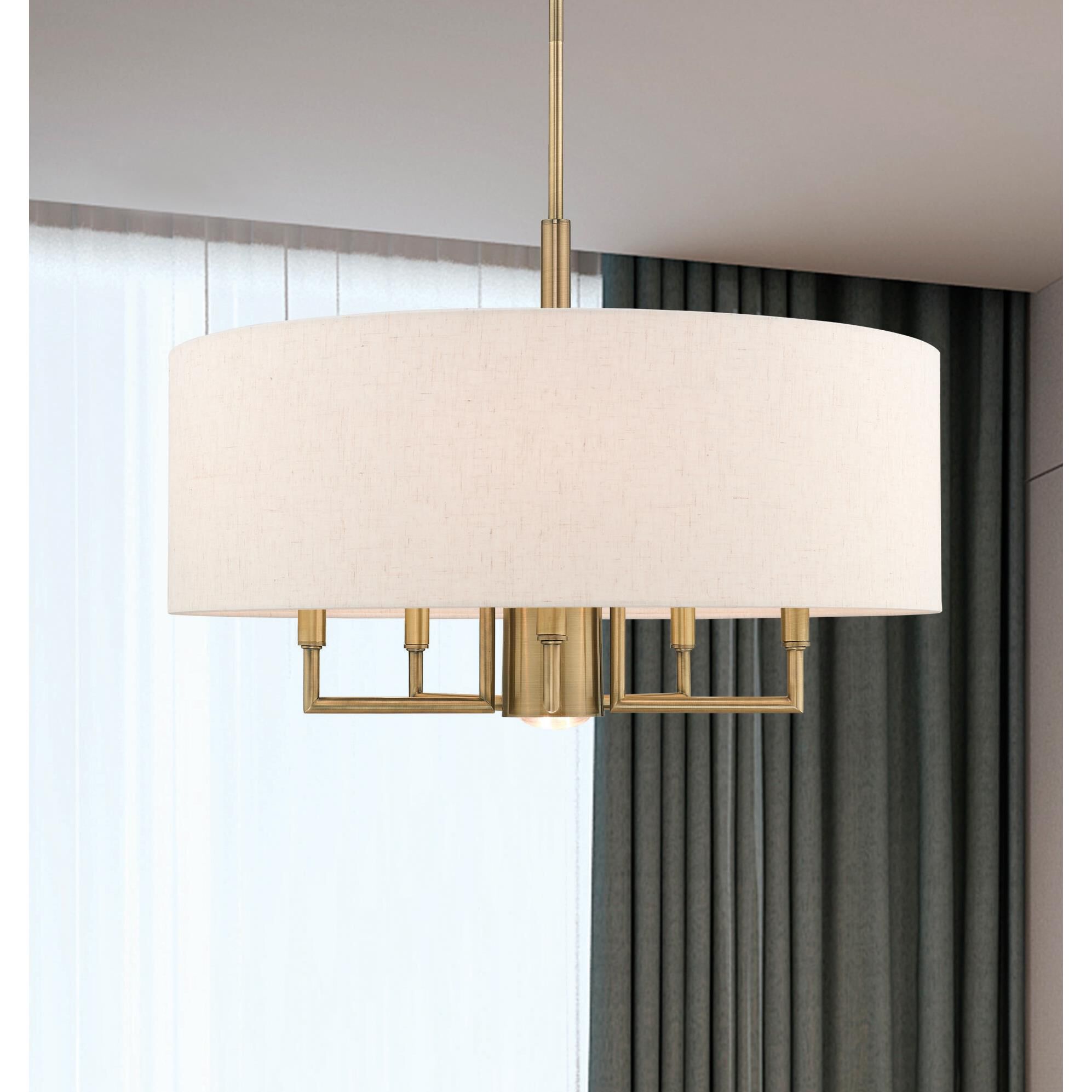 Shown in Antique Brass finish and Hand Crafted Oatmeal Fabric Hardback shade