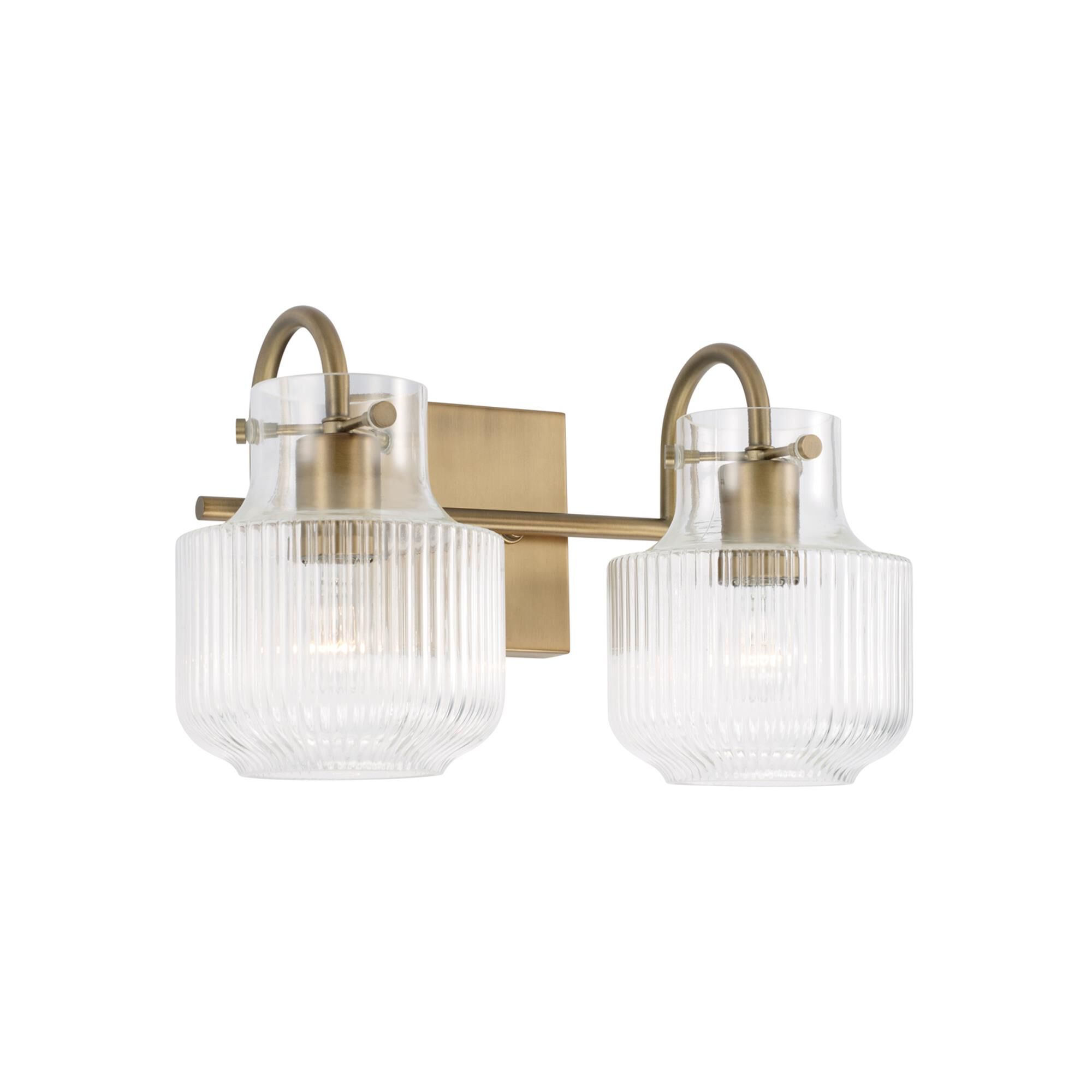 Shown in Aged Brass finish and Clear Fluted glass