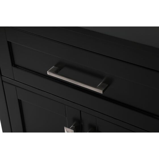 Close-up of a metal accent bar on a black cabinet door.