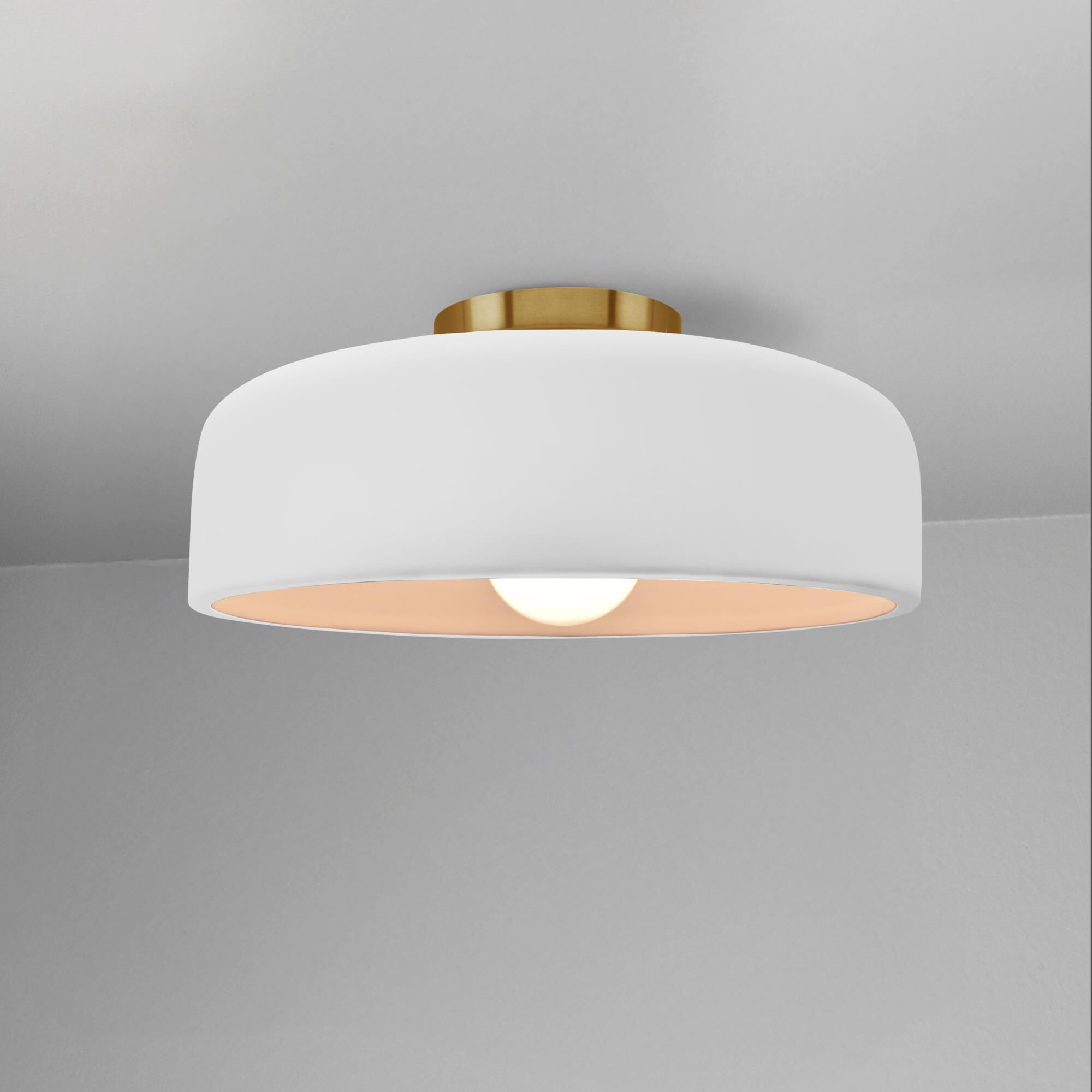 Shown in Brushed Brass finish and Bisque shade