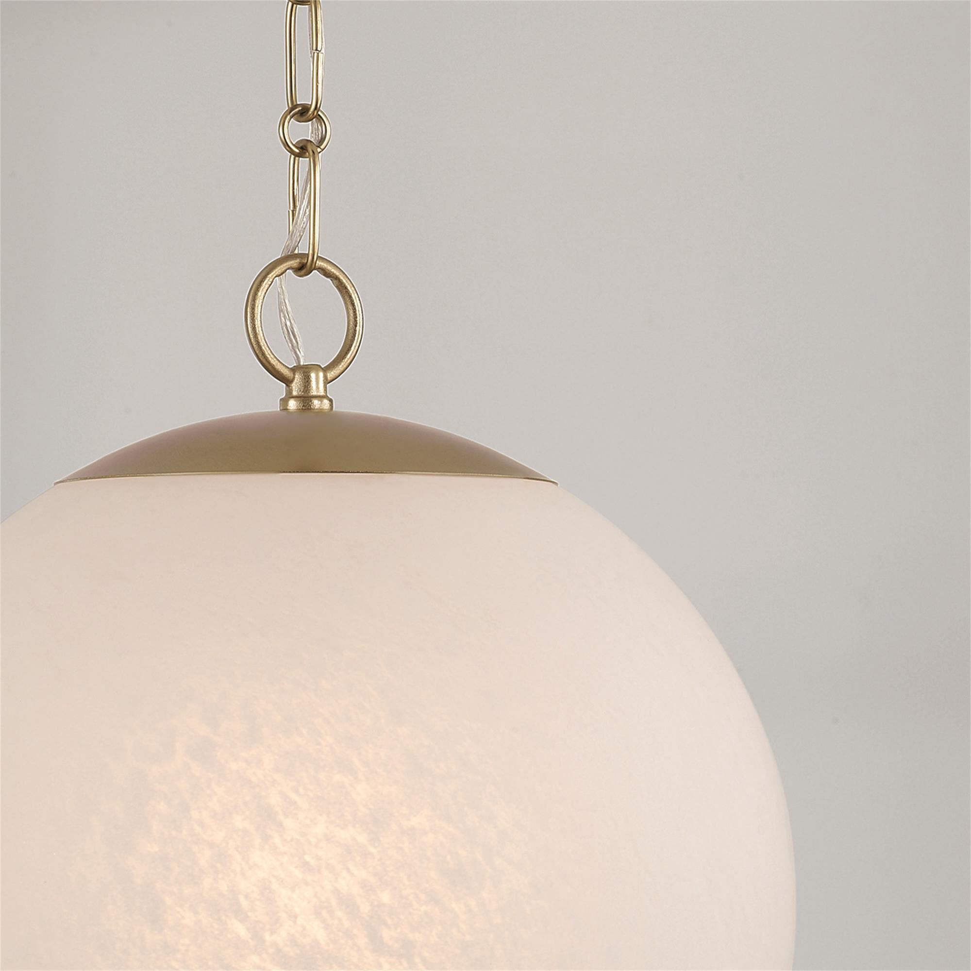 Shown in Matte Brass finish and Faux Alabaster glass