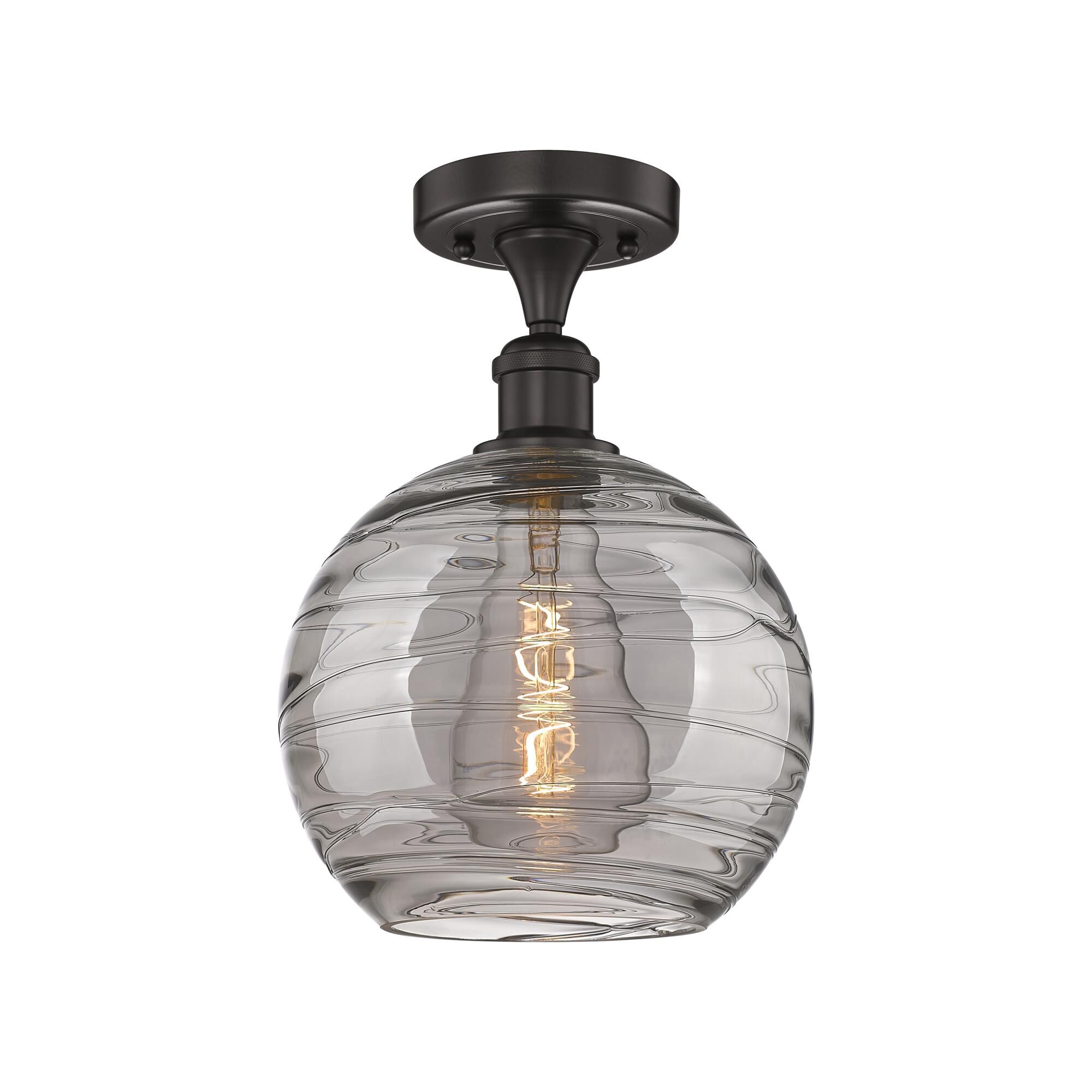 Shown in Oil Rubbed Bronze finish and Light Smoke Deco Swirl glass