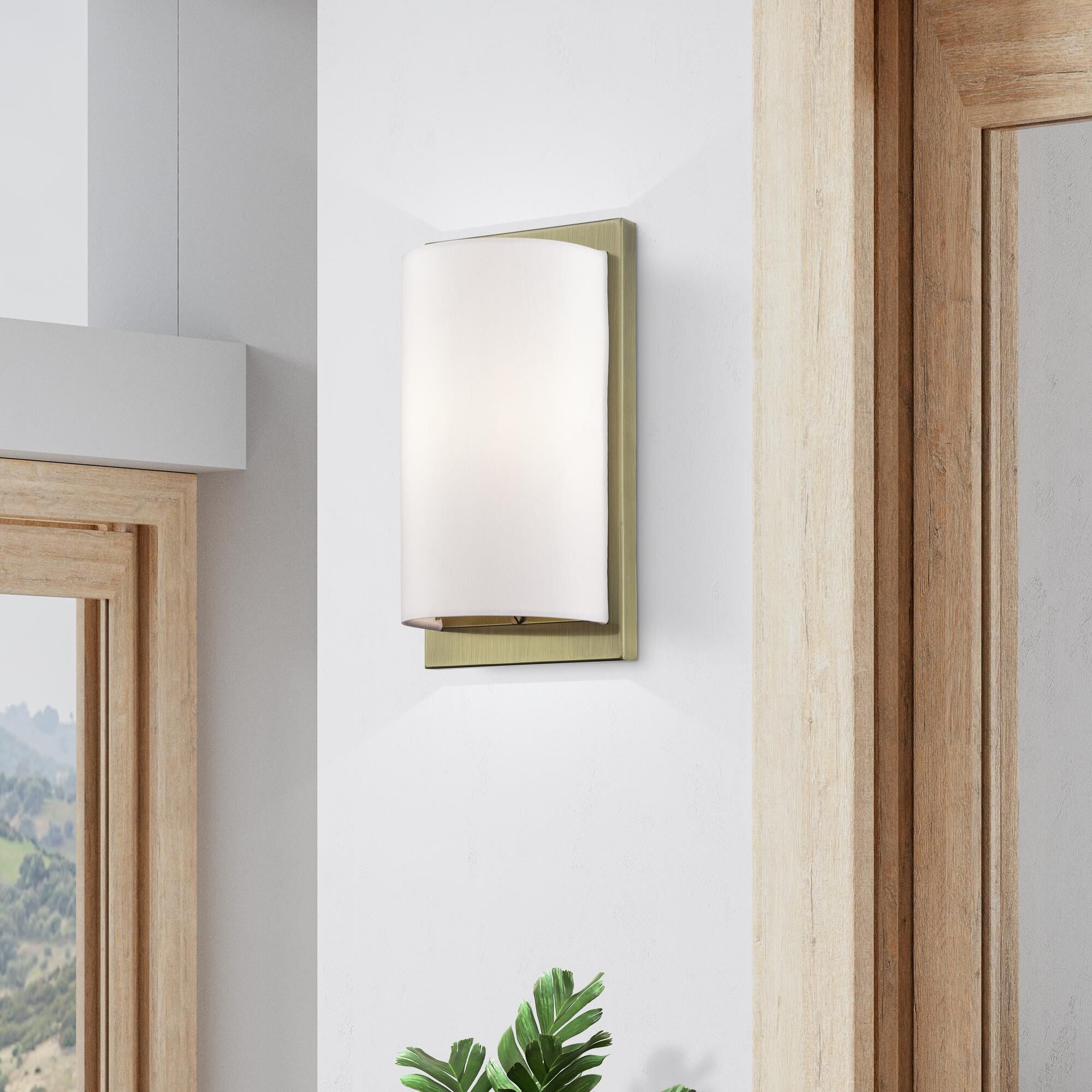 Shown in Antique Brass finish and Hand Crafted Off-White Fabric Hardback shade