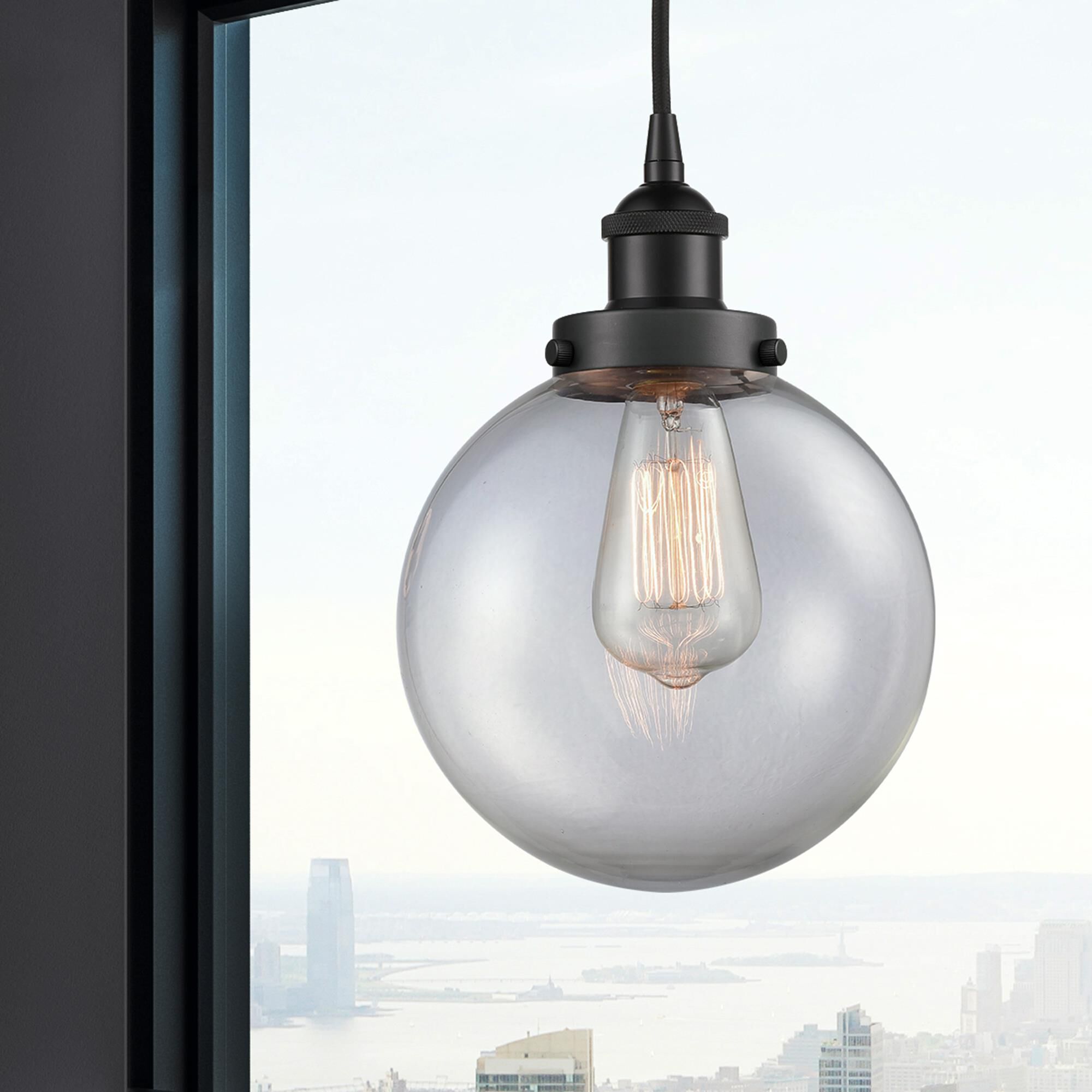 Shown in Matte Black finish and Clear Beacon glass
