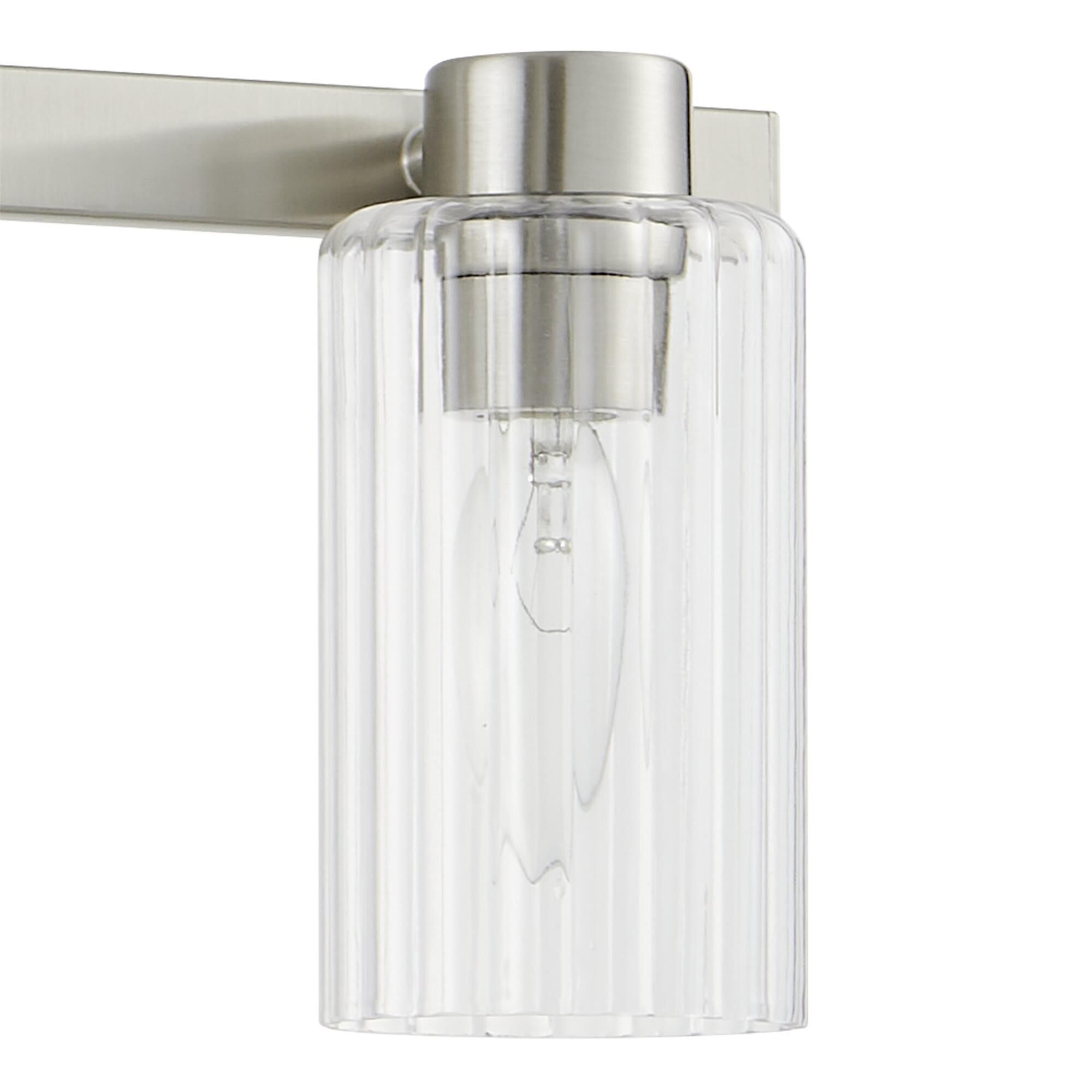 Shown in Brushed Nickel finish and Clear Ribbed glass