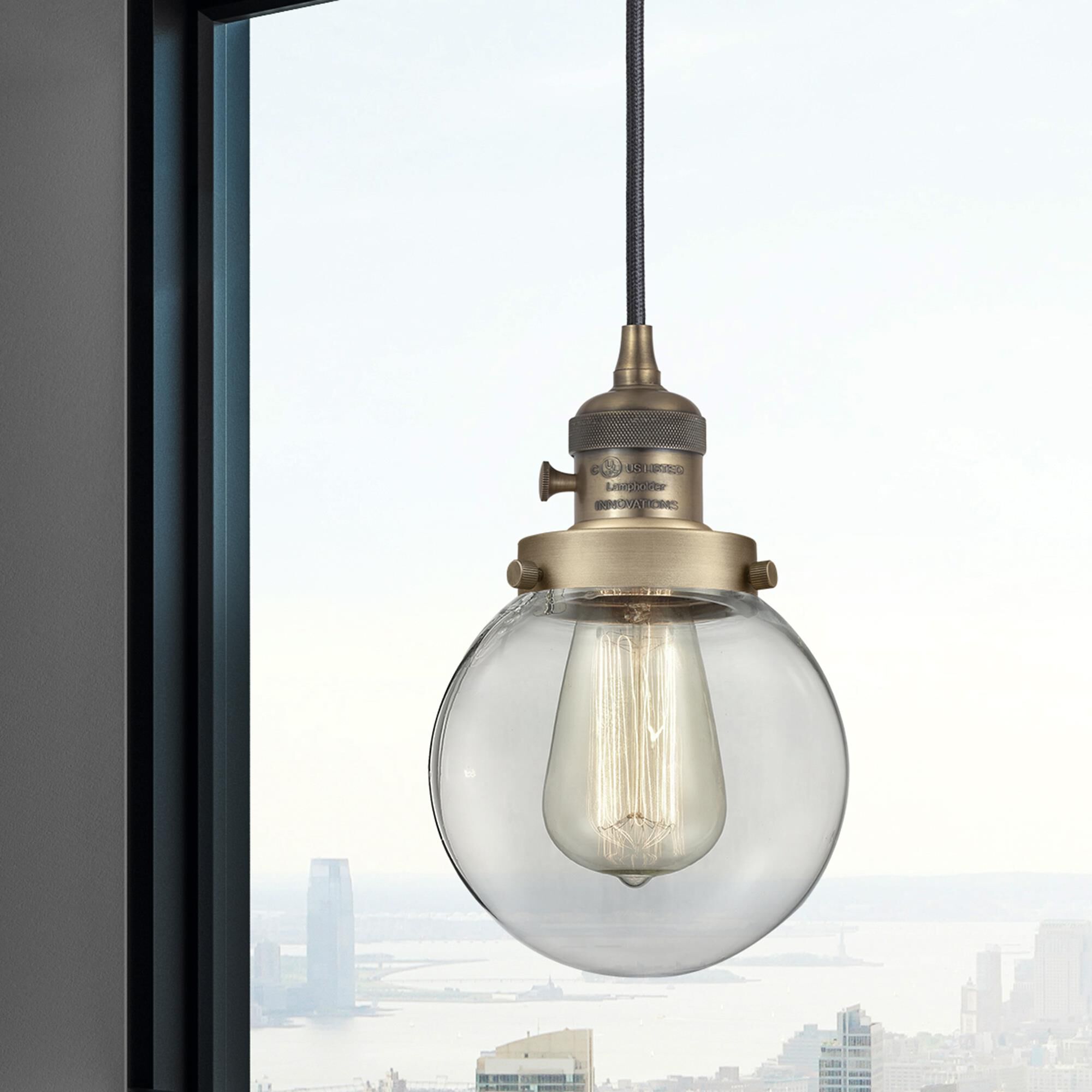 Shown in Brushed Brass finish and Clear glass