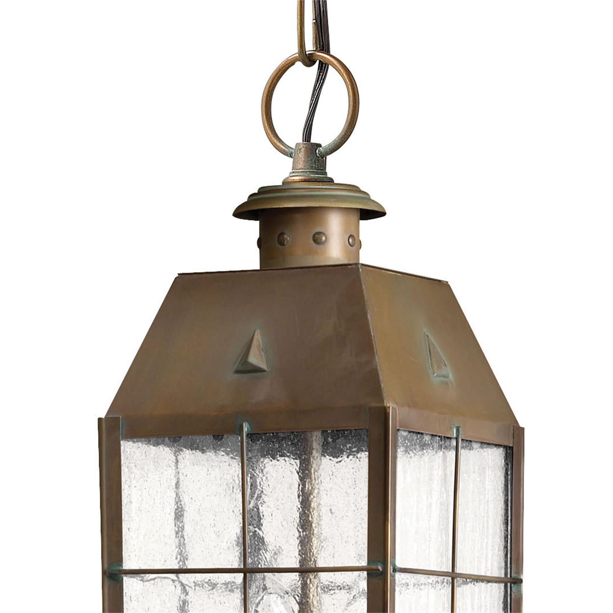 Shown in Aged Brass finish and Clear Seedy Panels glass