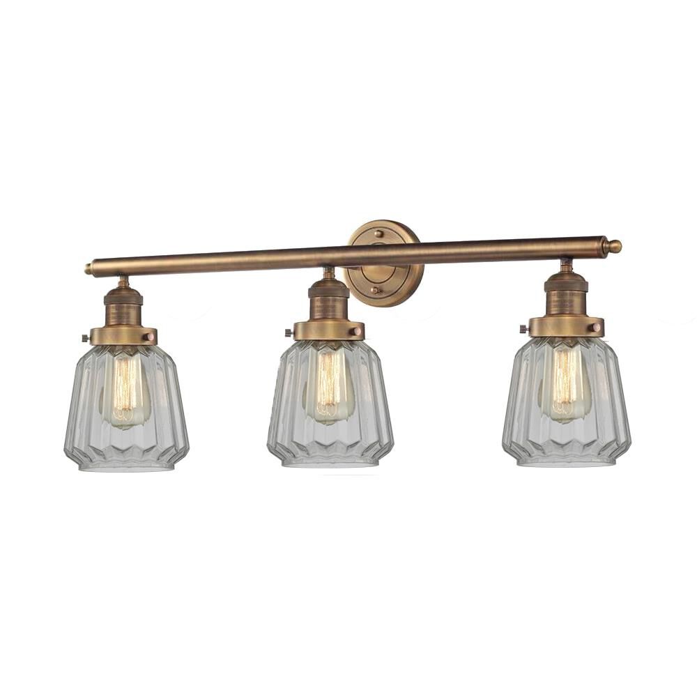 Shown in Brushed Brass finish and Clear Fluted glass