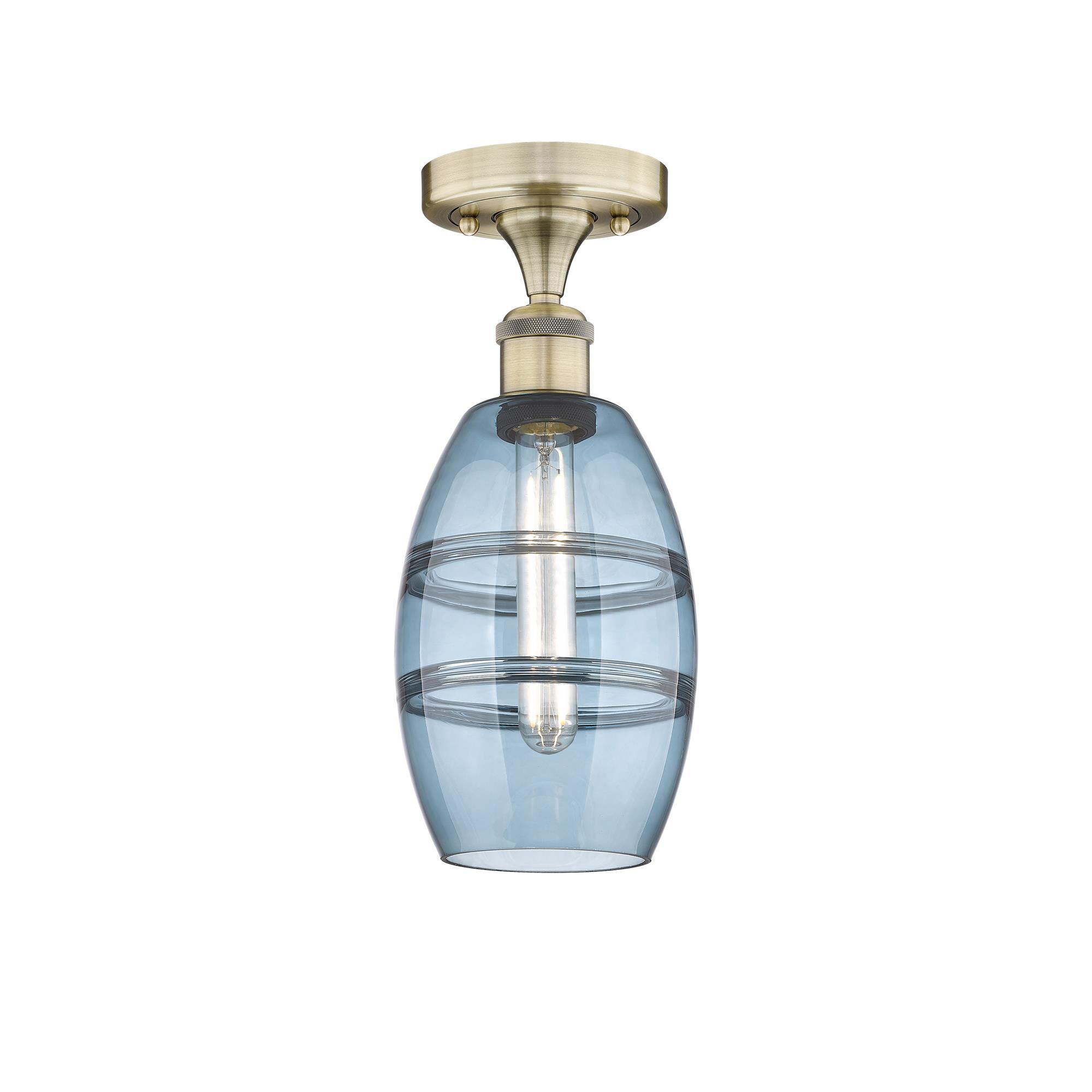 Shown in Antique Brass finish and Princess Blue glass