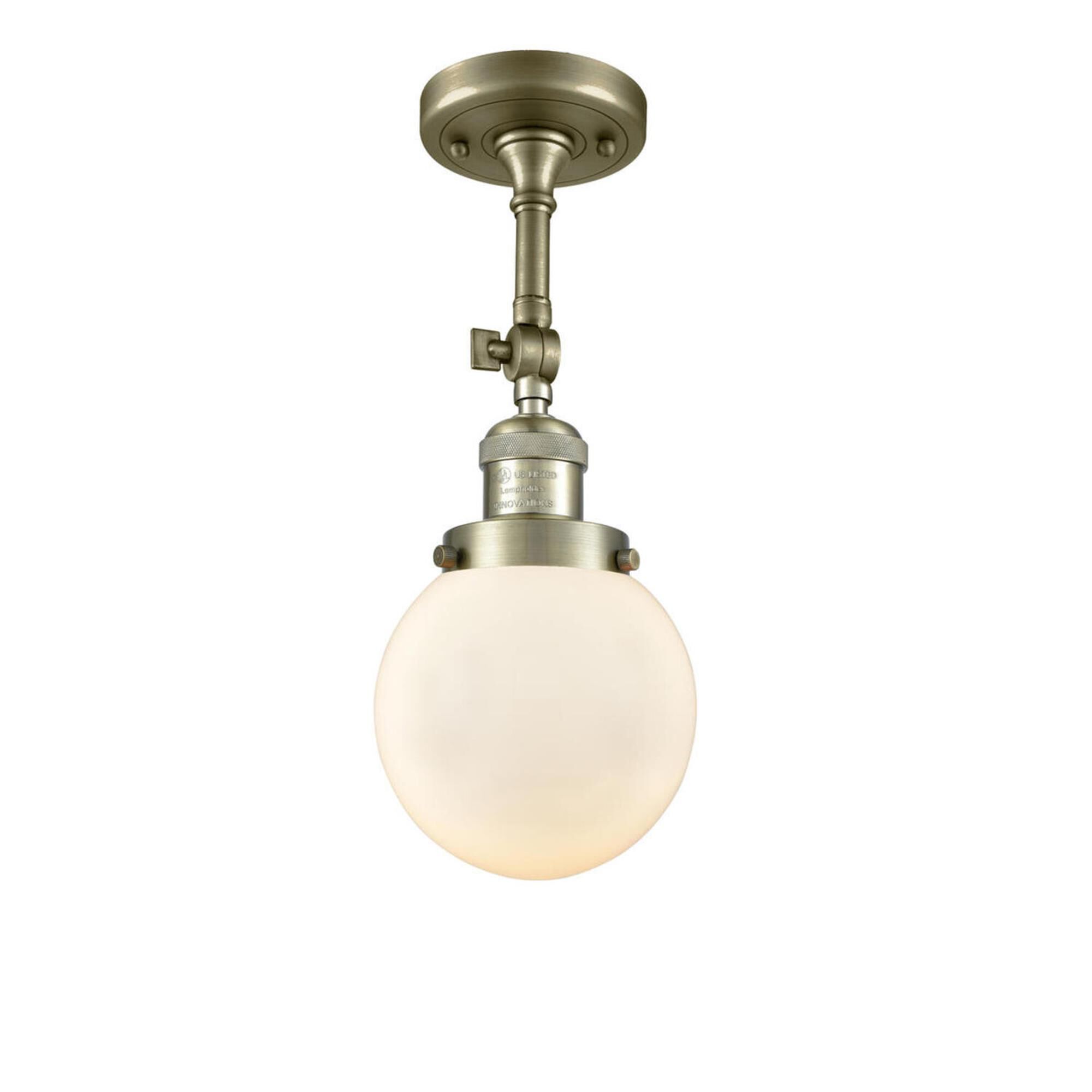 Shown in Antique Brass finish and Matte White Cased glass and No Accent accent