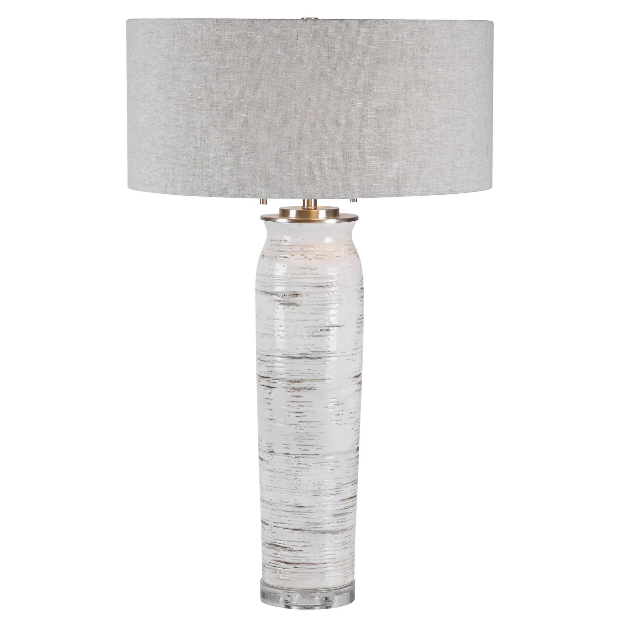 Shown in Inspired By The Bark Of A Birch Tree, This Table Lamp Features A Ceramic Base Finished In Off-White  finish and Round Hardback Drum shade