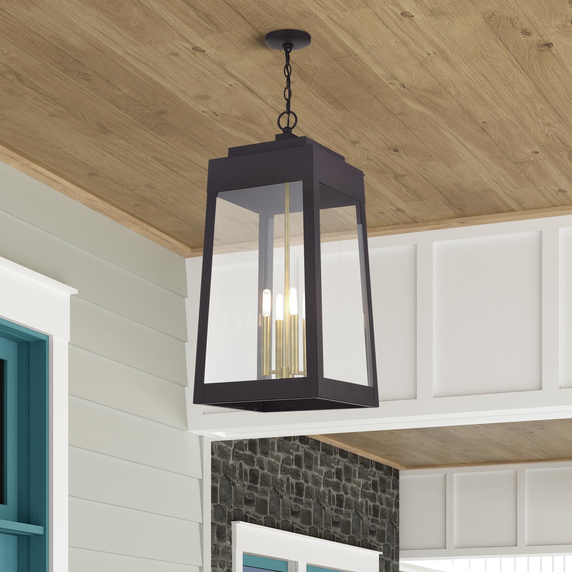 Shown in Bronze with Antique Brass Candles finish and Clear glass