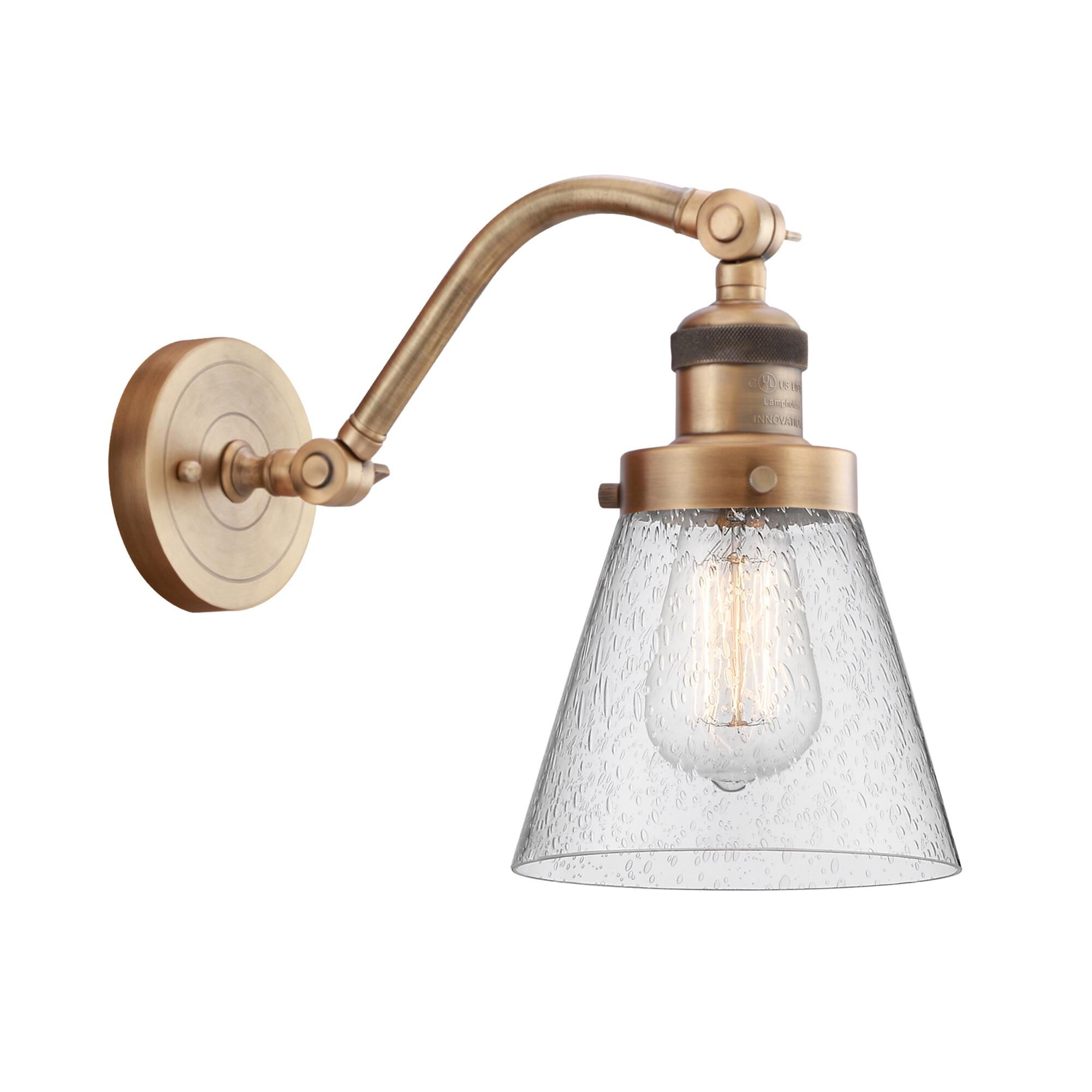 Shown in Brushed Brass finish and Seedy Small Cone glass