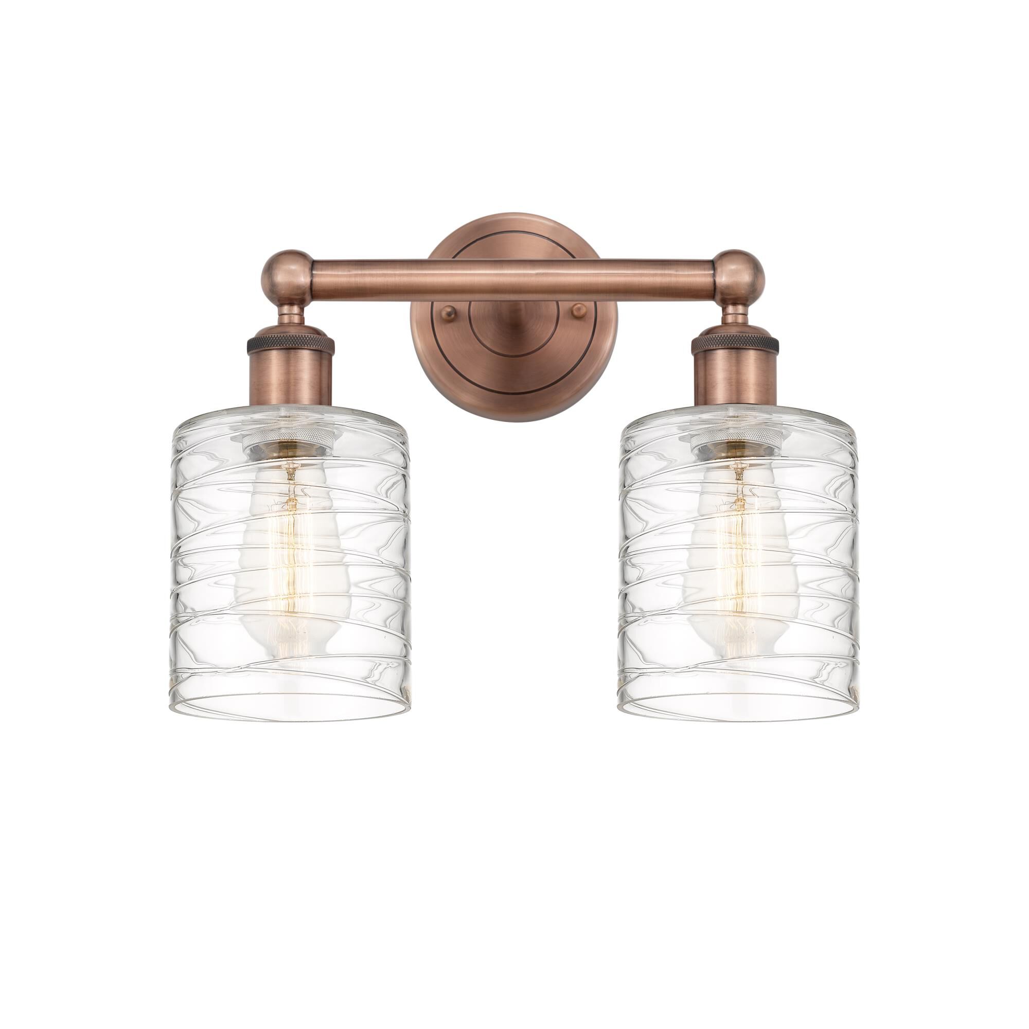 Shown in Antique Copper finish and Deco Swirl glass
