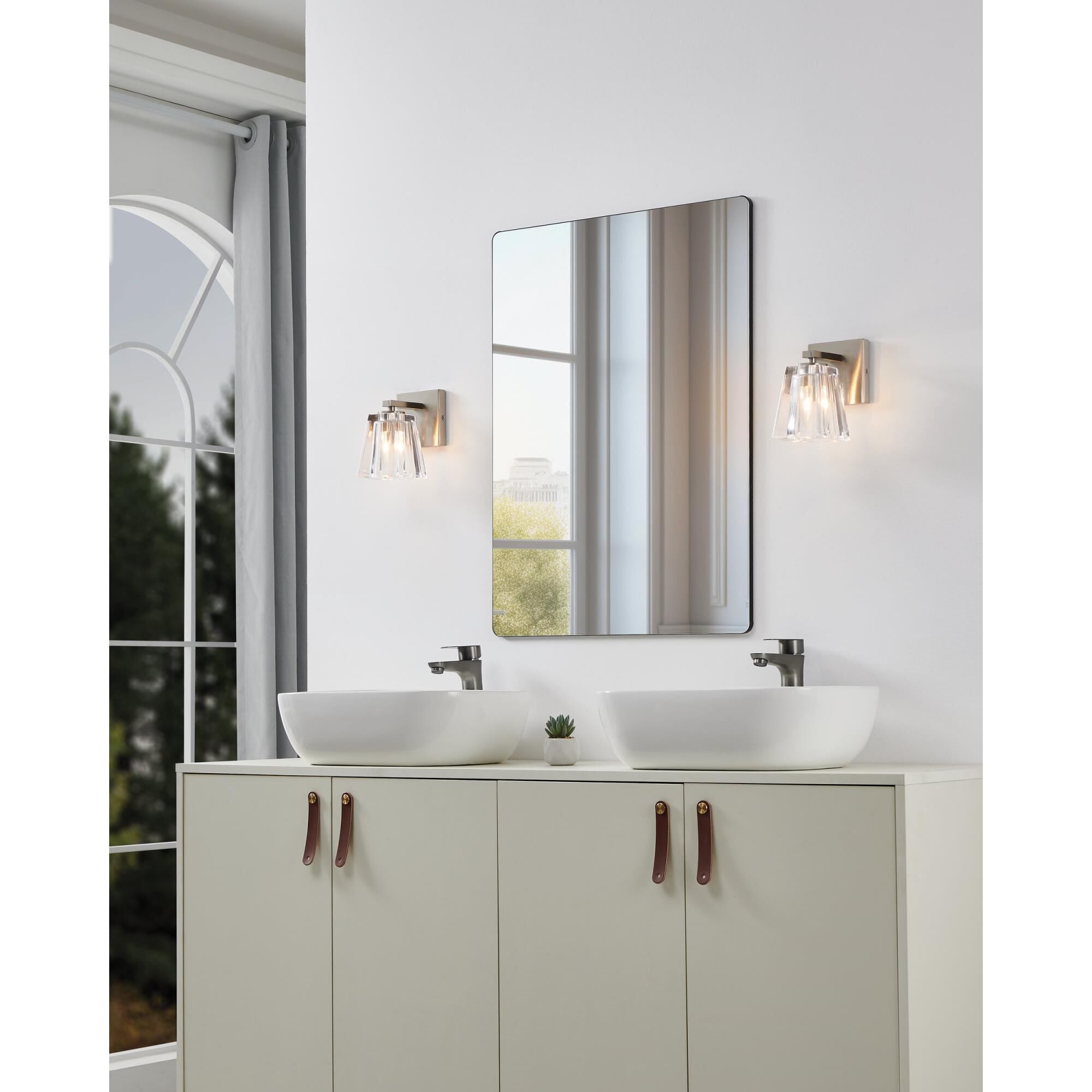 Shown in Brushed Nickel finish and Clear Pressed glass