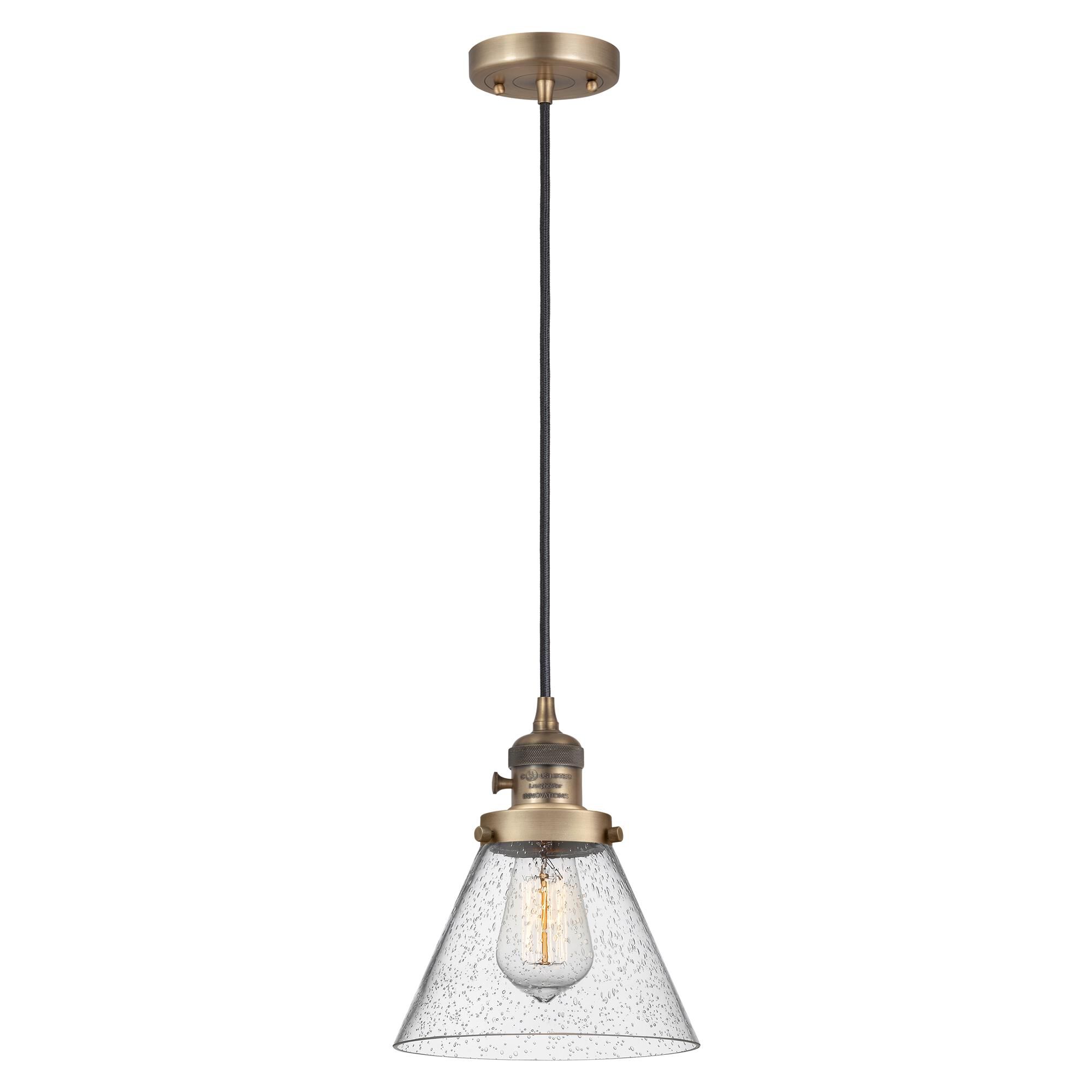 Shown in Brushed Brass finish and Seedy glass