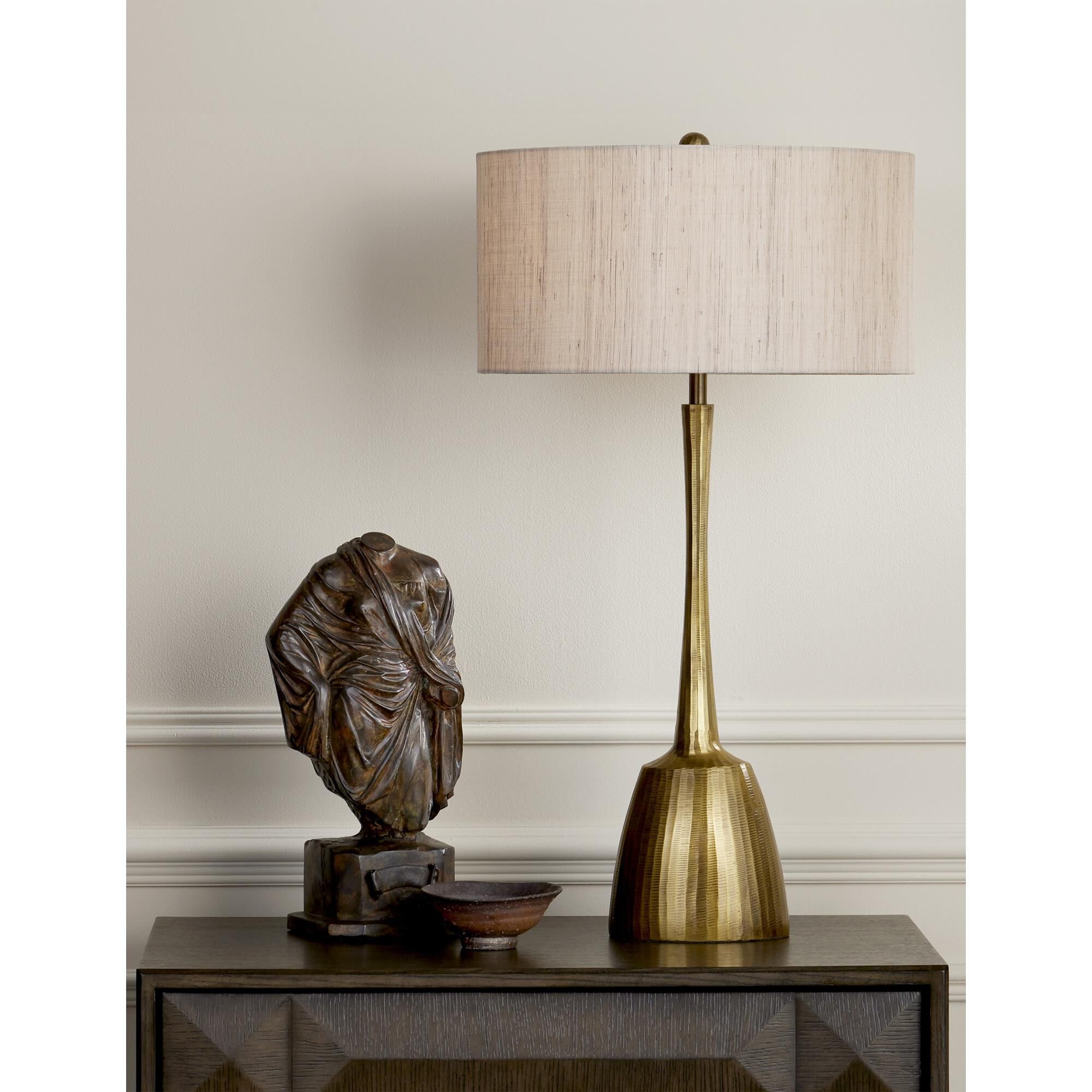 Shown in Antique Brass finish and Natural Linen shade