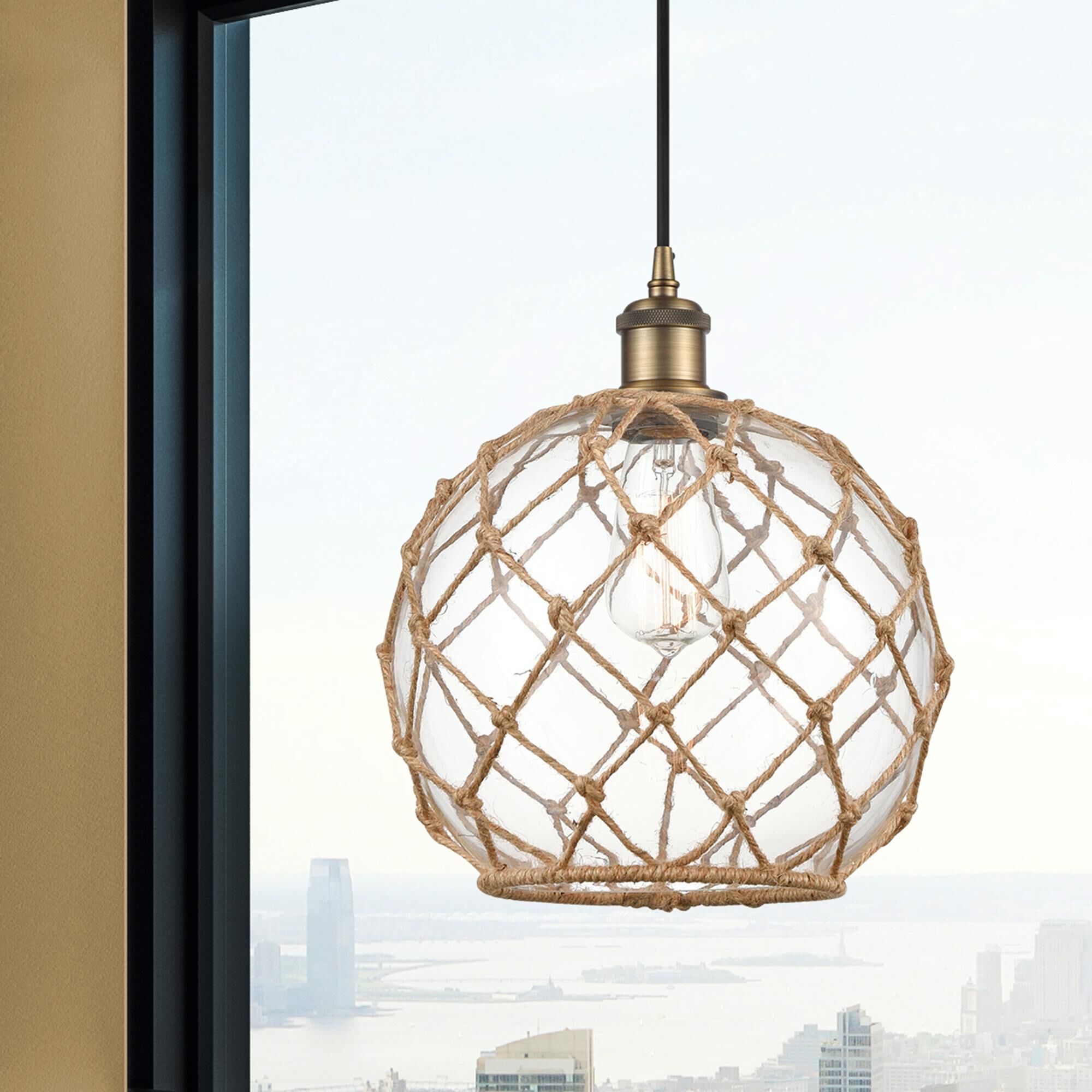 Shown in Brushed Brass finish and Clear Large Farmhousewith Brown Rope glass and Polished Chrome accent