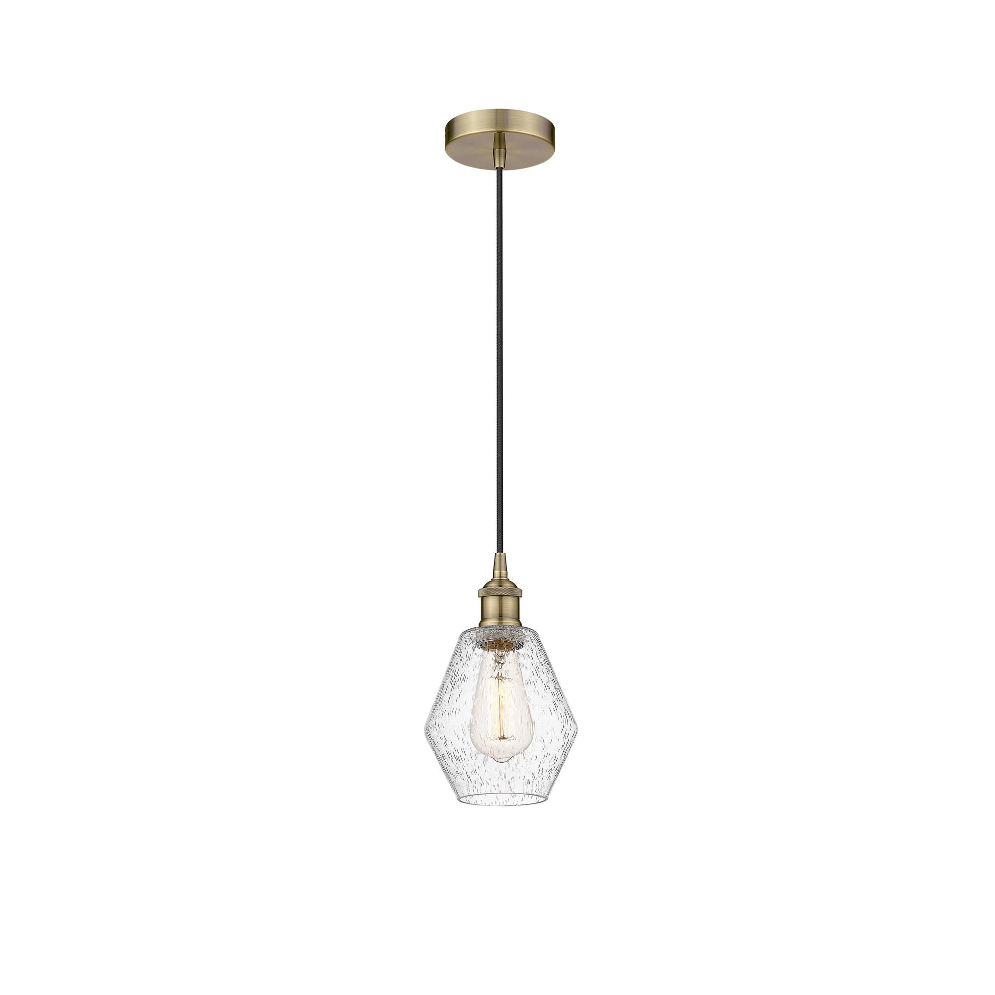 Shown in Antique Brass finish and Seedy glass