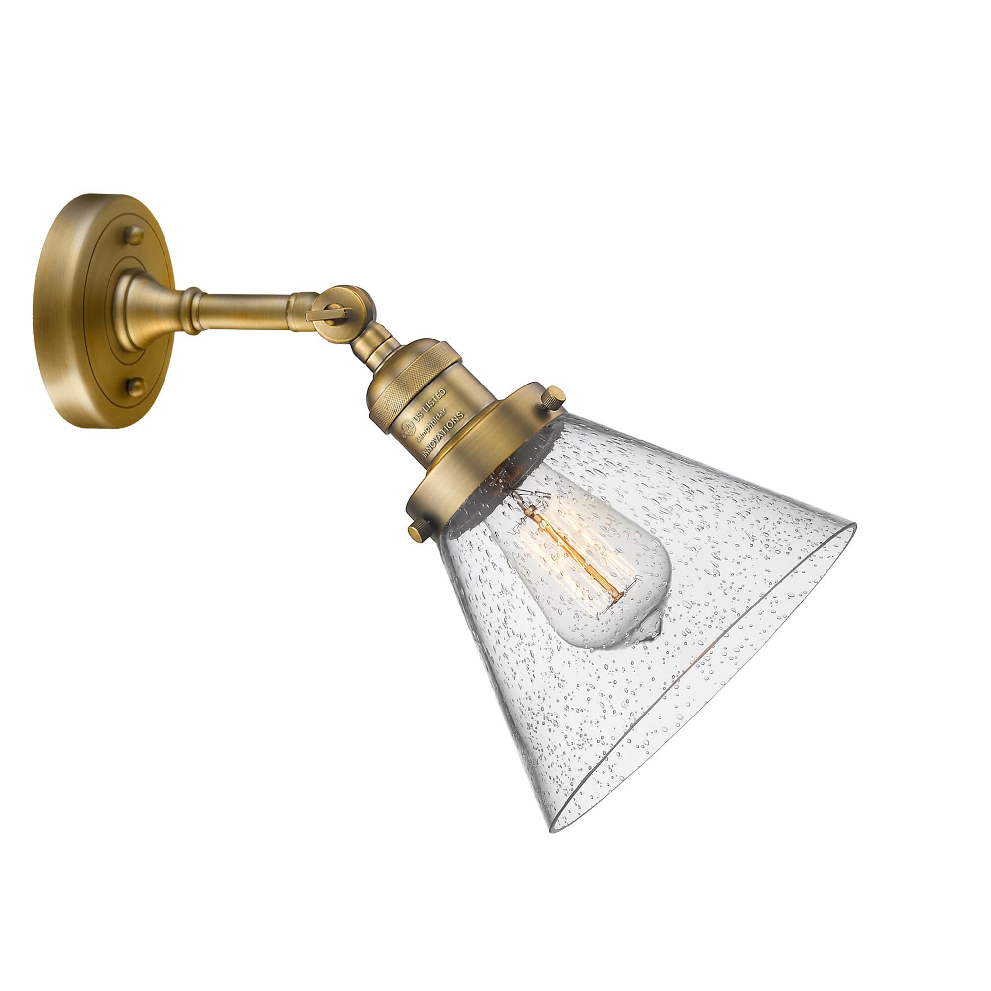 Shown in Brushed Brass finish and Seedy glass and None accent