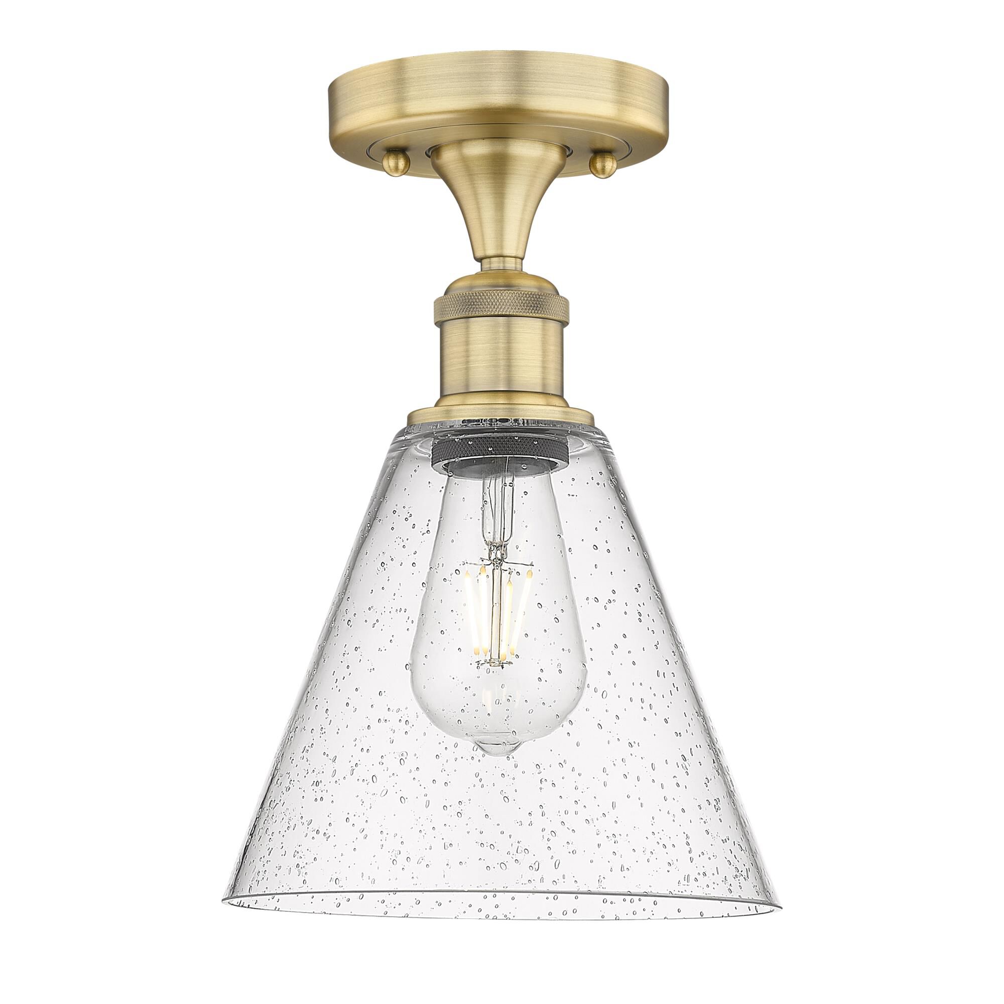 Shown in Brushed Brass finish and Seedy glass