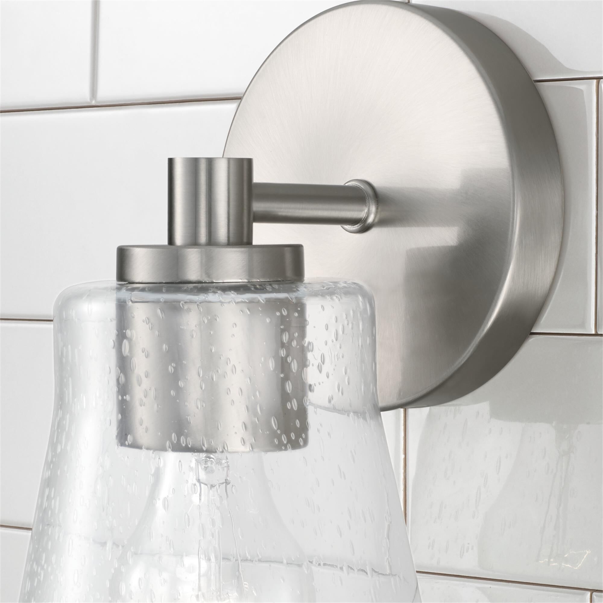 Shown in Brushed Nickel finish and Clear Seeded glass