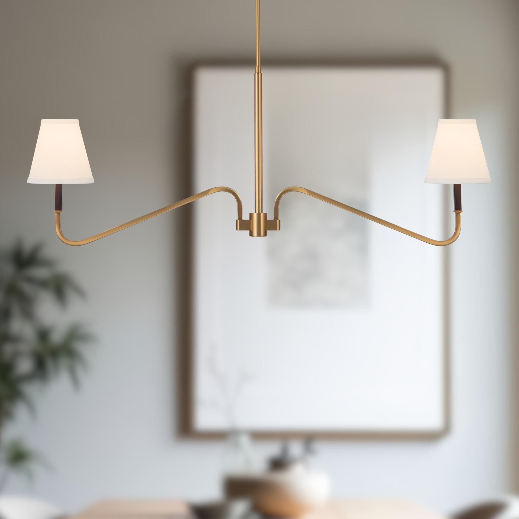 Shown in Brushed Gold finish and White Linen shade