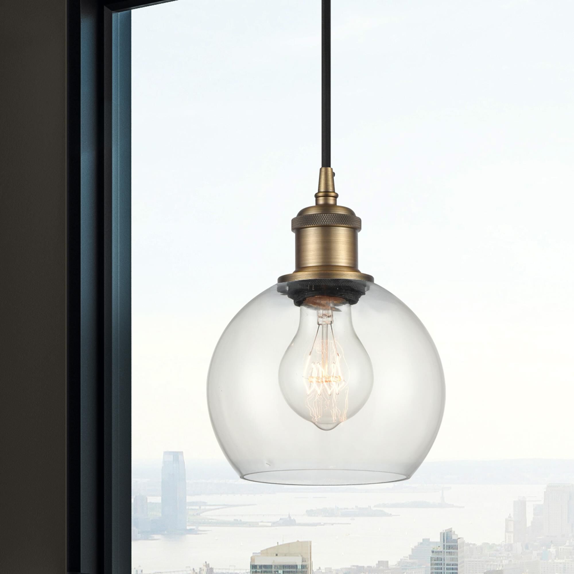 Shown in Brushed Brass finish and Clear glass