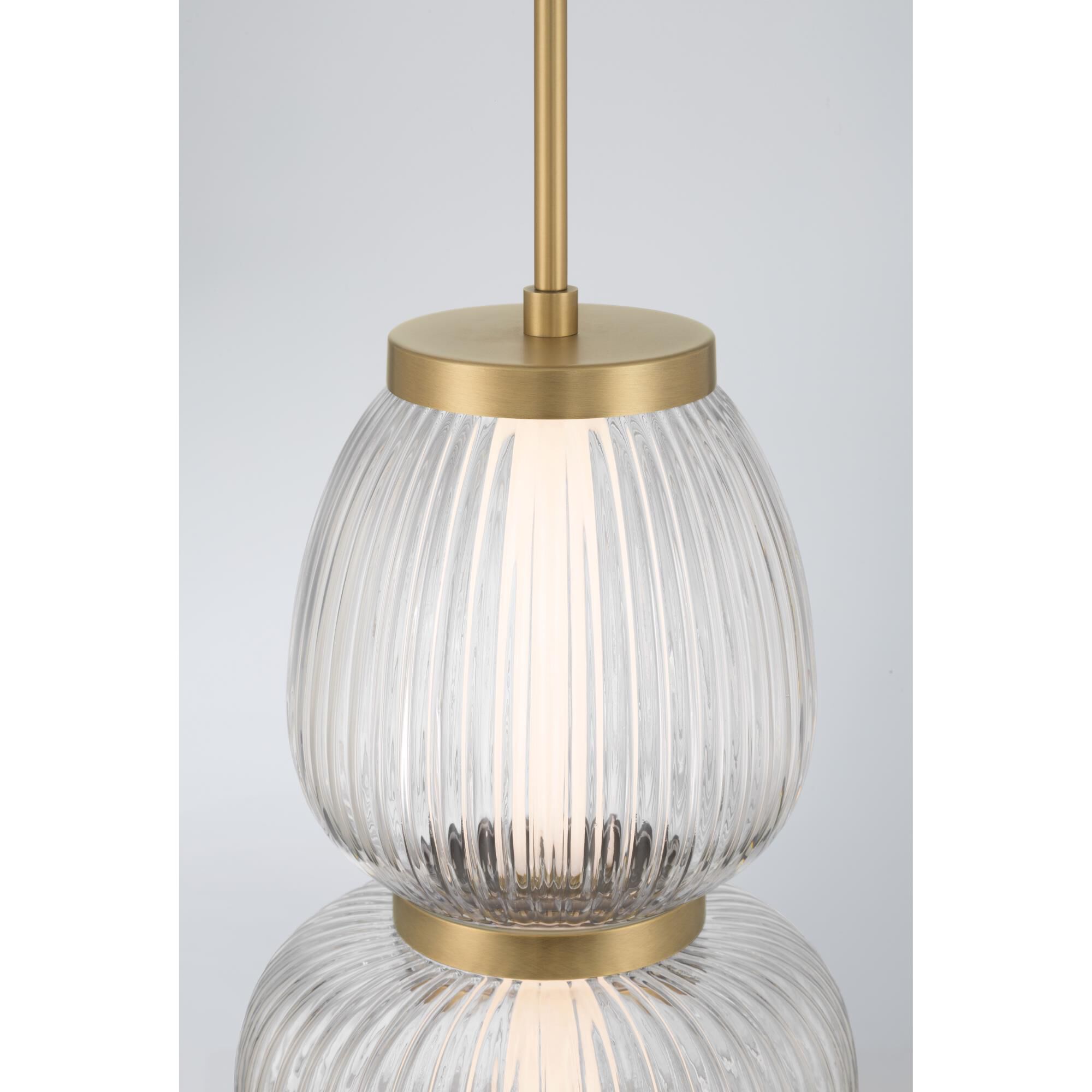 Shown in Legacy Brass finish and Clear Ribbed glass