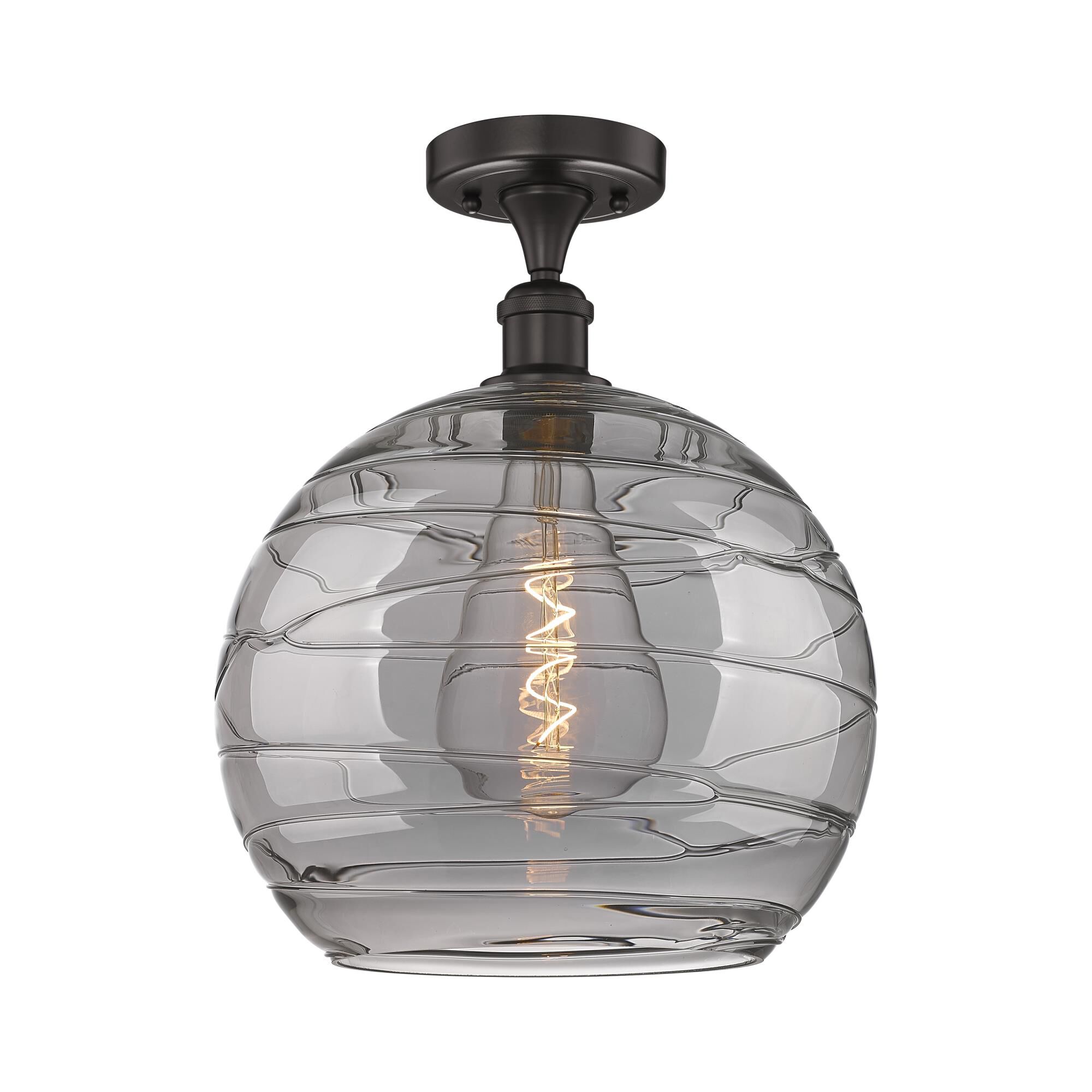 Shown in Oil Rubbed Bronze finish and Light Smoke Deco Swirl glass