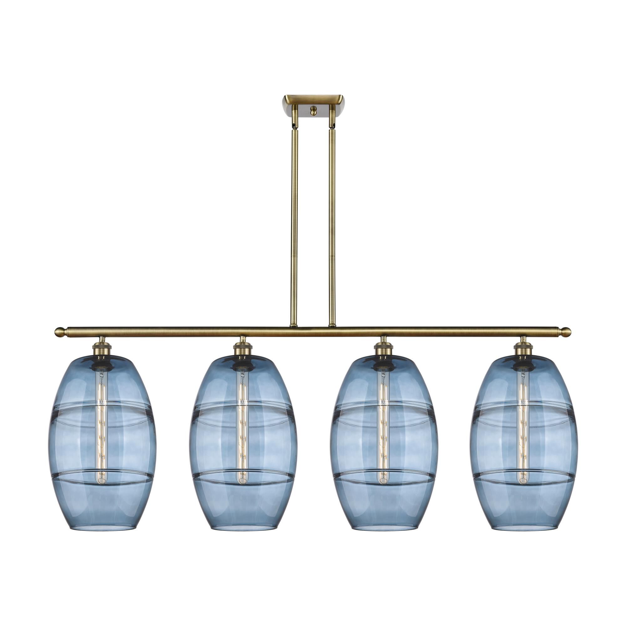 Shown in Antique Brass finish and Princess Blue glass