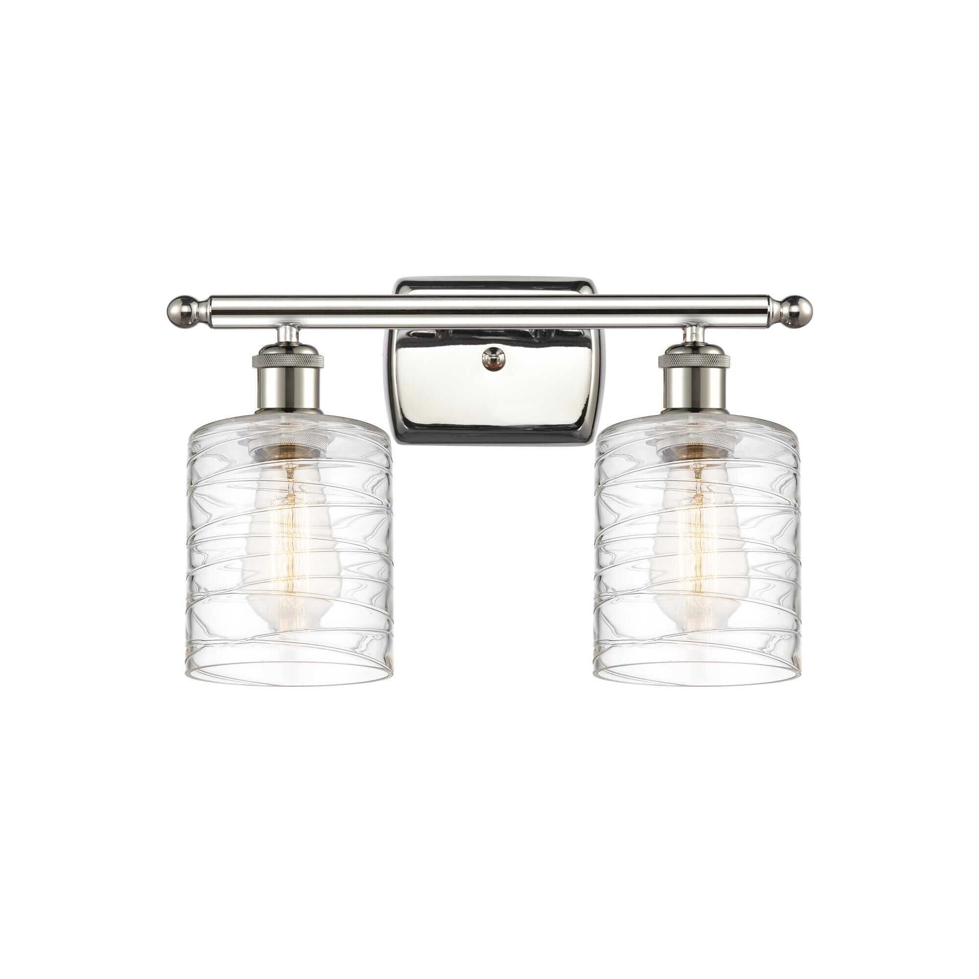 Shown in Polished Nickel finish and Deco Swirl Cobbleskill glass