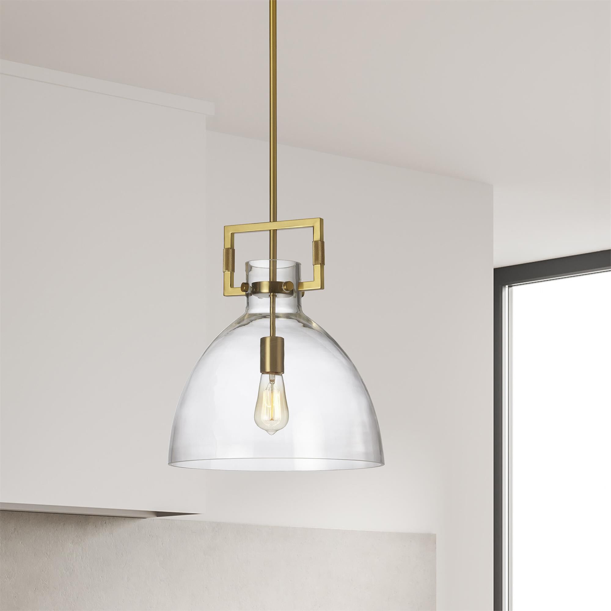 Shown in Clear and Aged Brass finish and Clear Dome glass