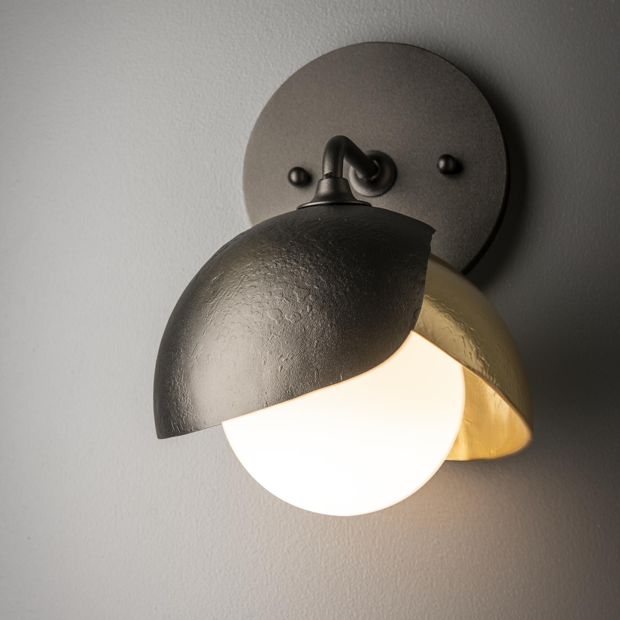 Shown in Oil Rubbed Bronze finish and Opal glass and Modern Brass (86) accent