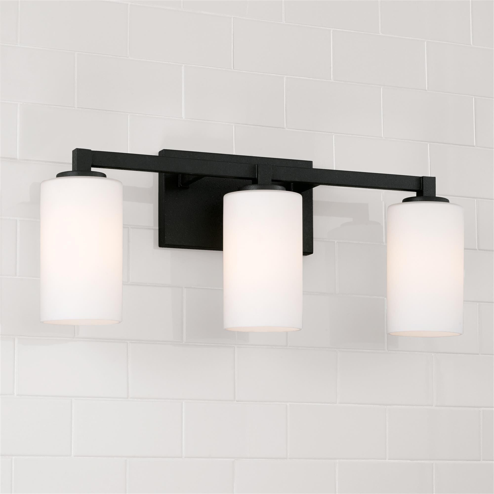 Shown in Black Iron finish and Soft White glass