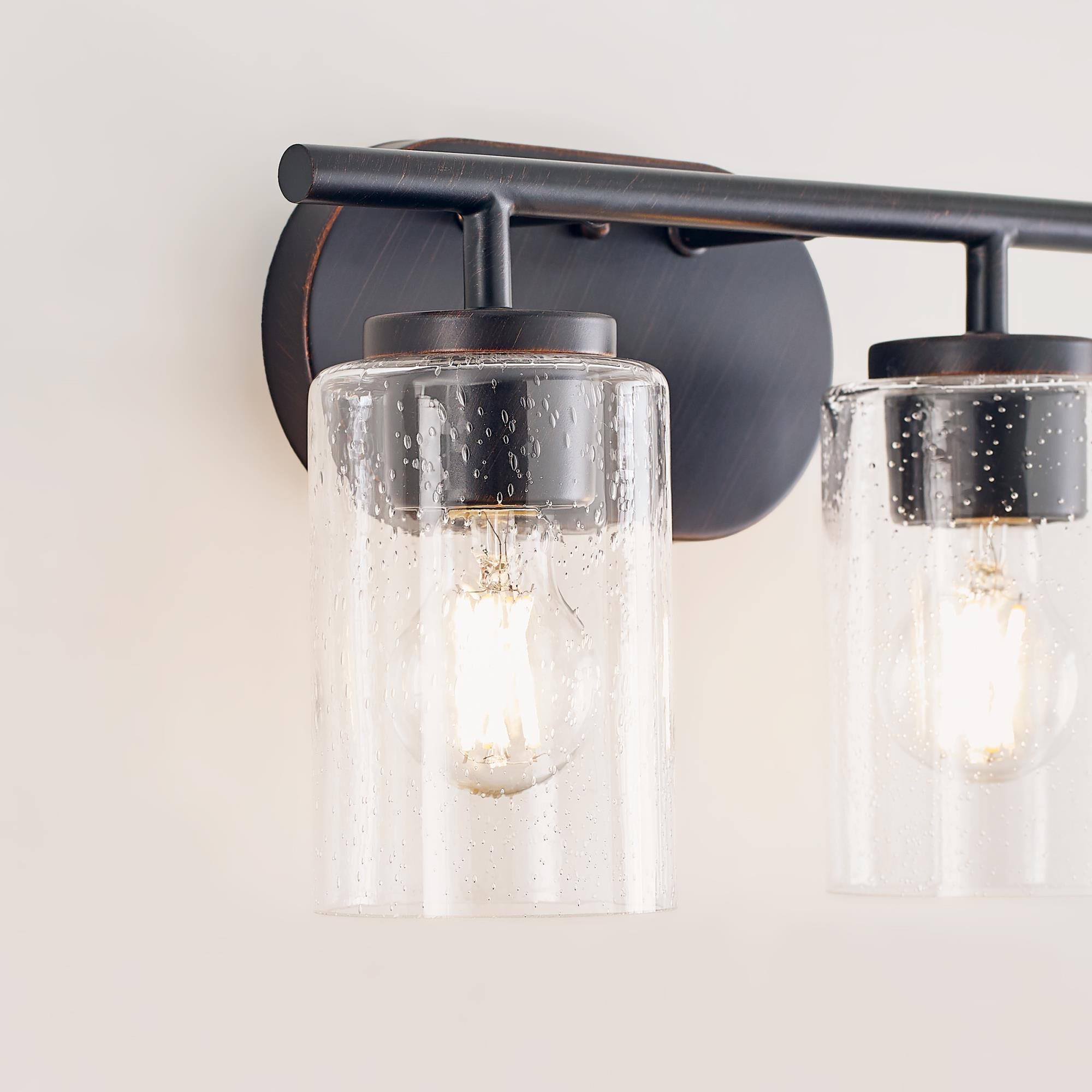 Shown in Bronze finish and Clear Seeded glass