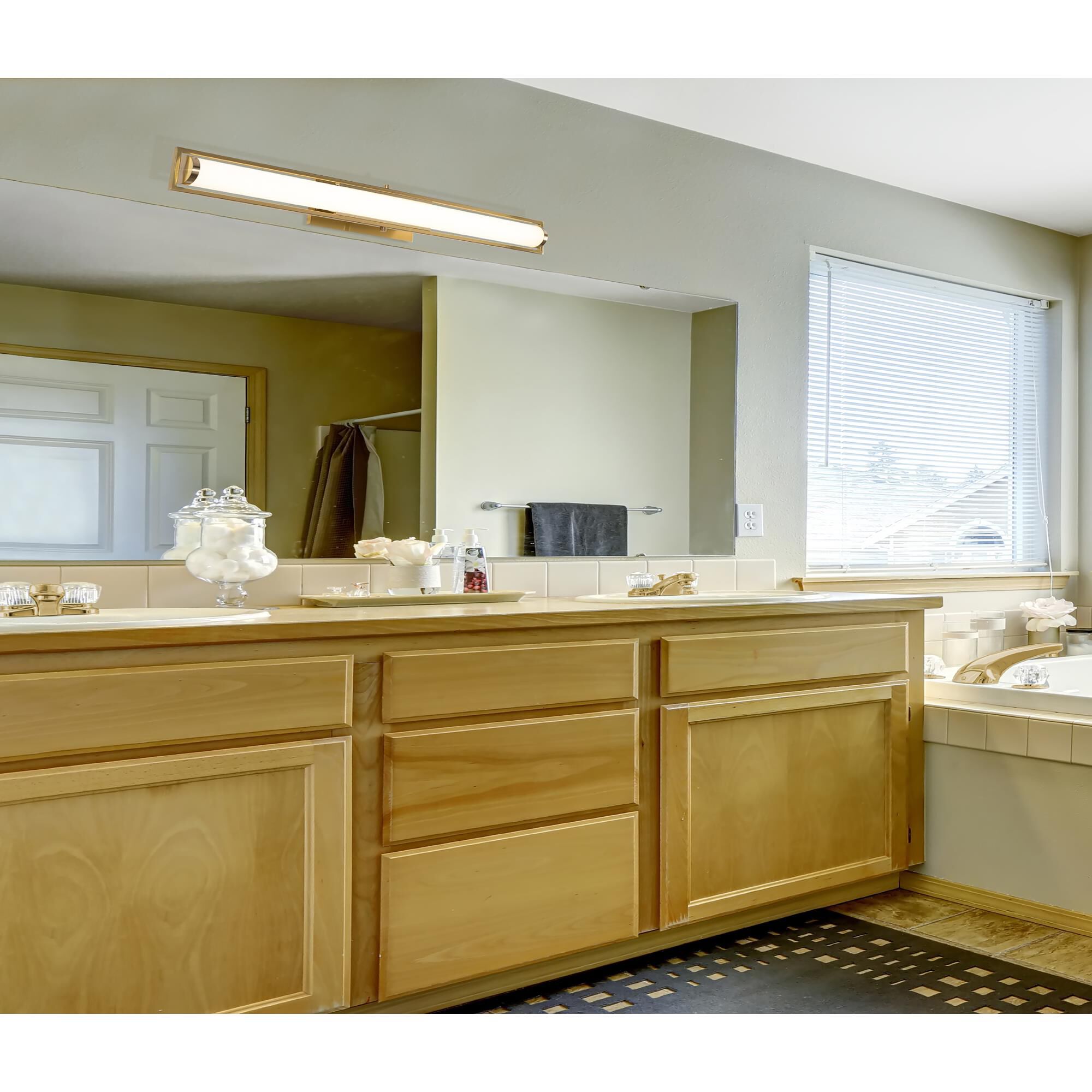 Shown in Light Antique Brass finish and Frosted shade